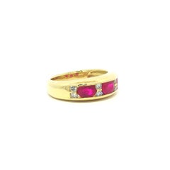 18k Yellow Gold 1.46ctw Channel Oval Ruby w/ Round Diamond East West Band Ring
