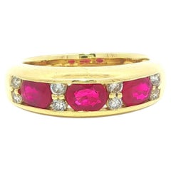 18k Yellow Gold 1.46ctw Channel Oval Ruby w/ Round Diamond East West Band Ring