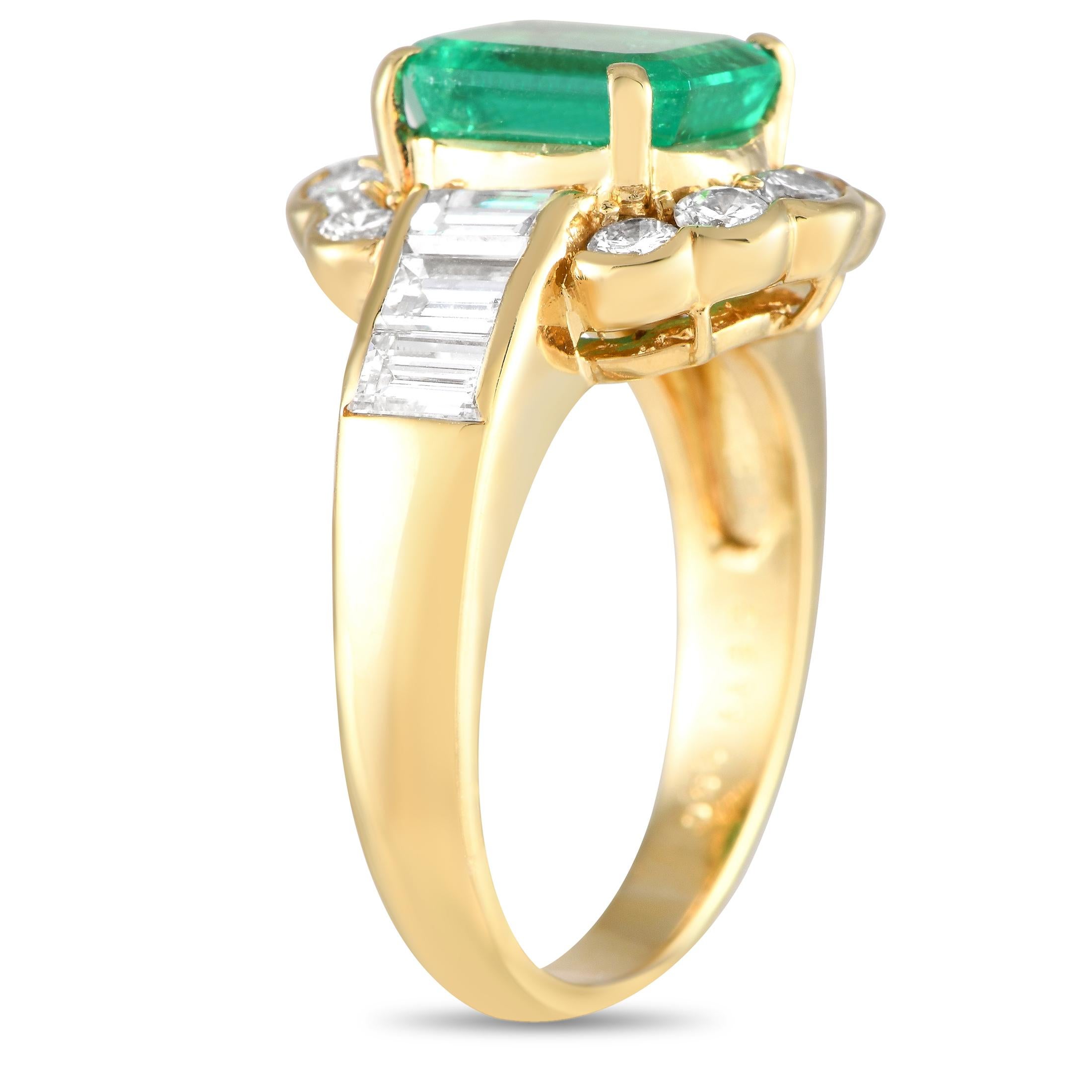 This opulent ring possesses a distinct old fashioned elegance. Diamonds with a total weight of 1.50 carats shine brightly from their place within the 18K Yellow Gold setting, while a stunning 2.21 carat emerald center stone serves as a stunning