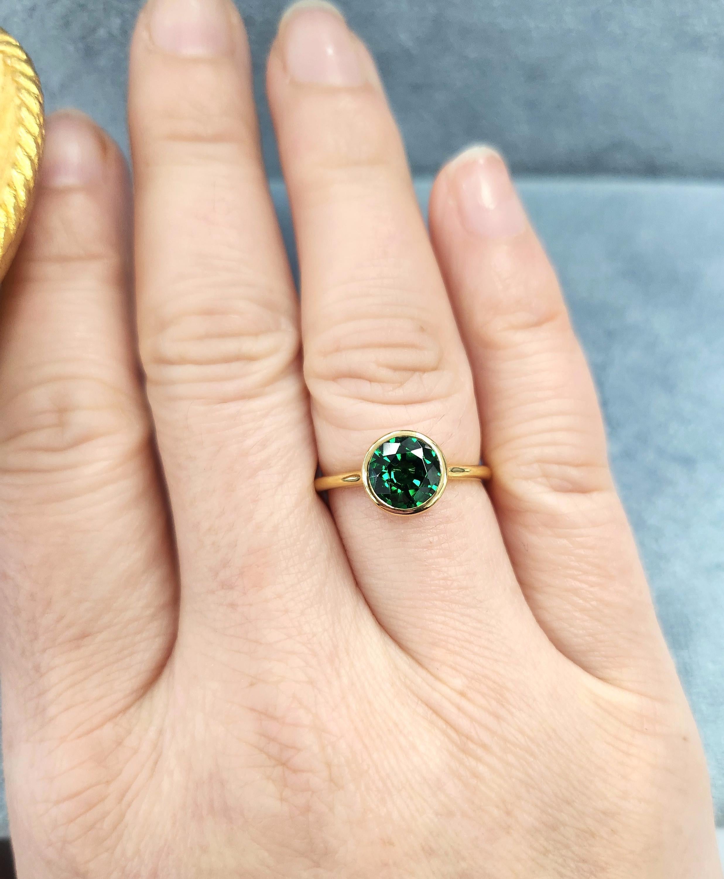 Tsavorite garnet is a vibrant green, rivaling the finest emeralds with its rich, glowing hue. Naturally untreated and highly sought after, tsavorite garnet is cherished for its exceptional brilliance and rarity.

This stunning 1.57-carat tsavorite