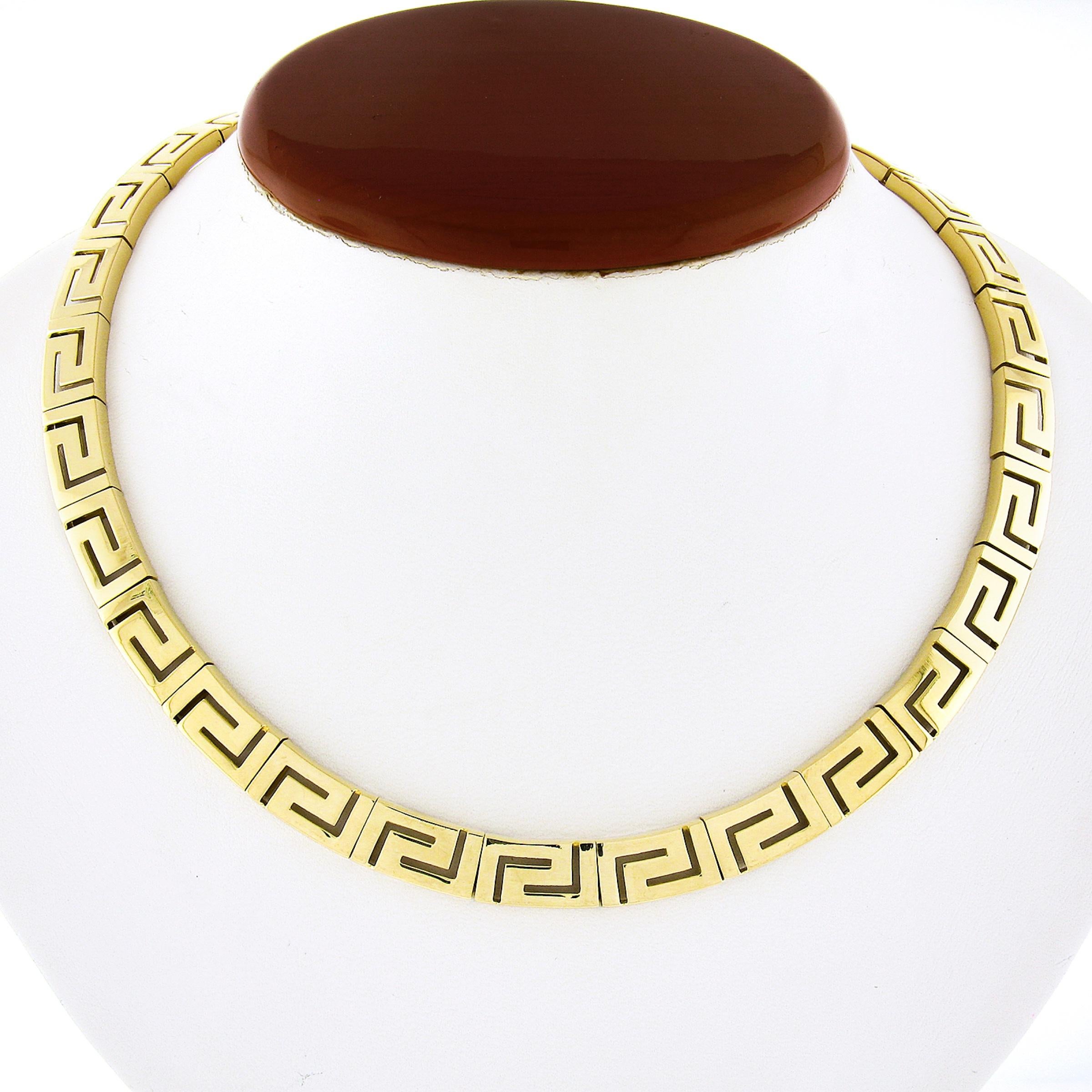 Here we have a fancy and very well made collar statement necklace that was crafted from solid 18k yellow gold. This beautiful chain is constructed from gorgeous open work Greek Key design links that have a wonderful high polished finish throughout