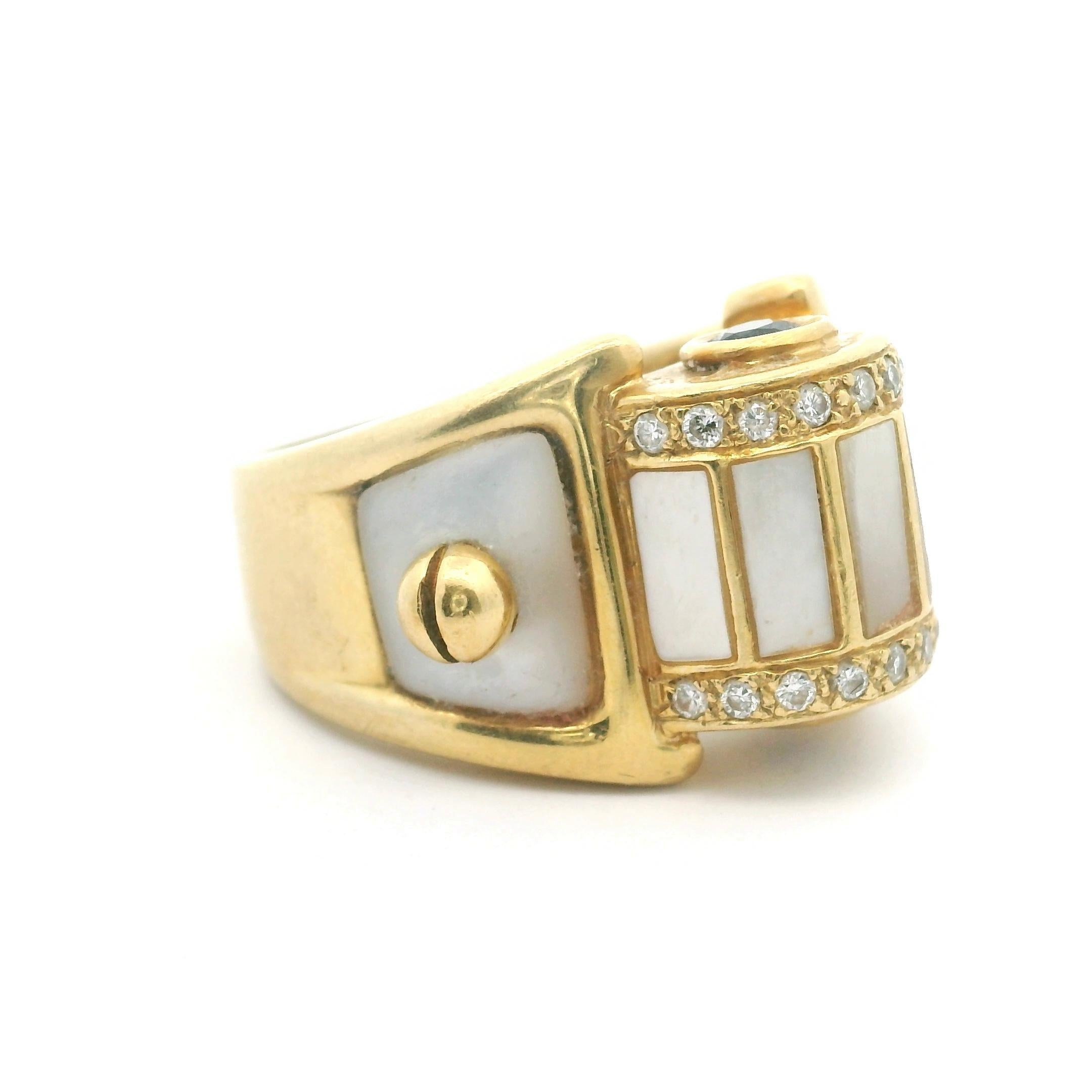 Condition:  Excellent Condition, Professionally Cleaned and Polished
Metal:  18k Gold (Marked, and Professionally Tested)
Weight:  15.1g
Gemstone:  Mother of Pearl
Gemstone:  Two Round Cut Blue Sapphires
Diamonds:  Round Cut Natural Diamonds