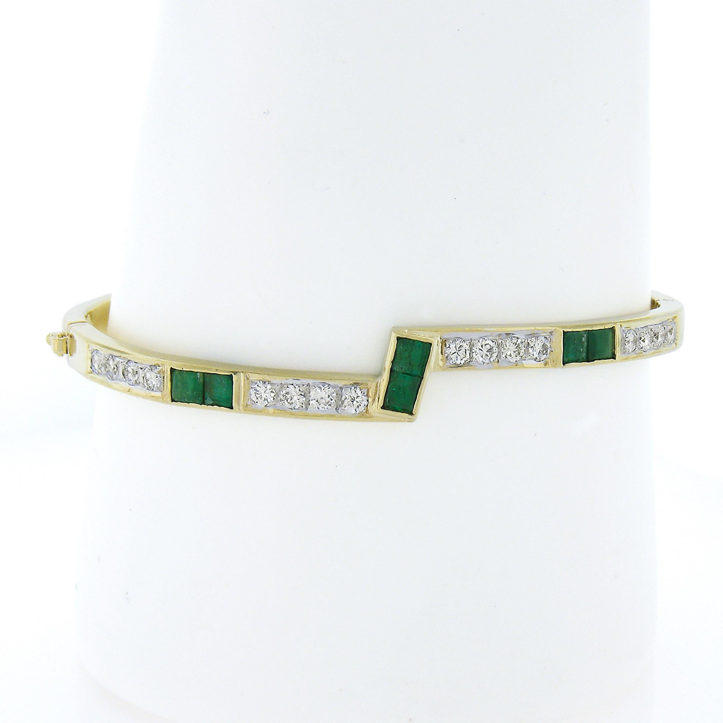 Up for sale is this stylish and perfectly stackable bangle bracelet that is crafted in solid 18k yellow gold. It features round brilliant cut diamonds that are accented with square step cut natural emeralds throughout. These fiery diamonds and rich