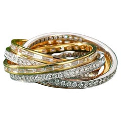 Anillos de oro amarillo y blanco de 18 quilates con múltiples diamantes 3,058 quilates