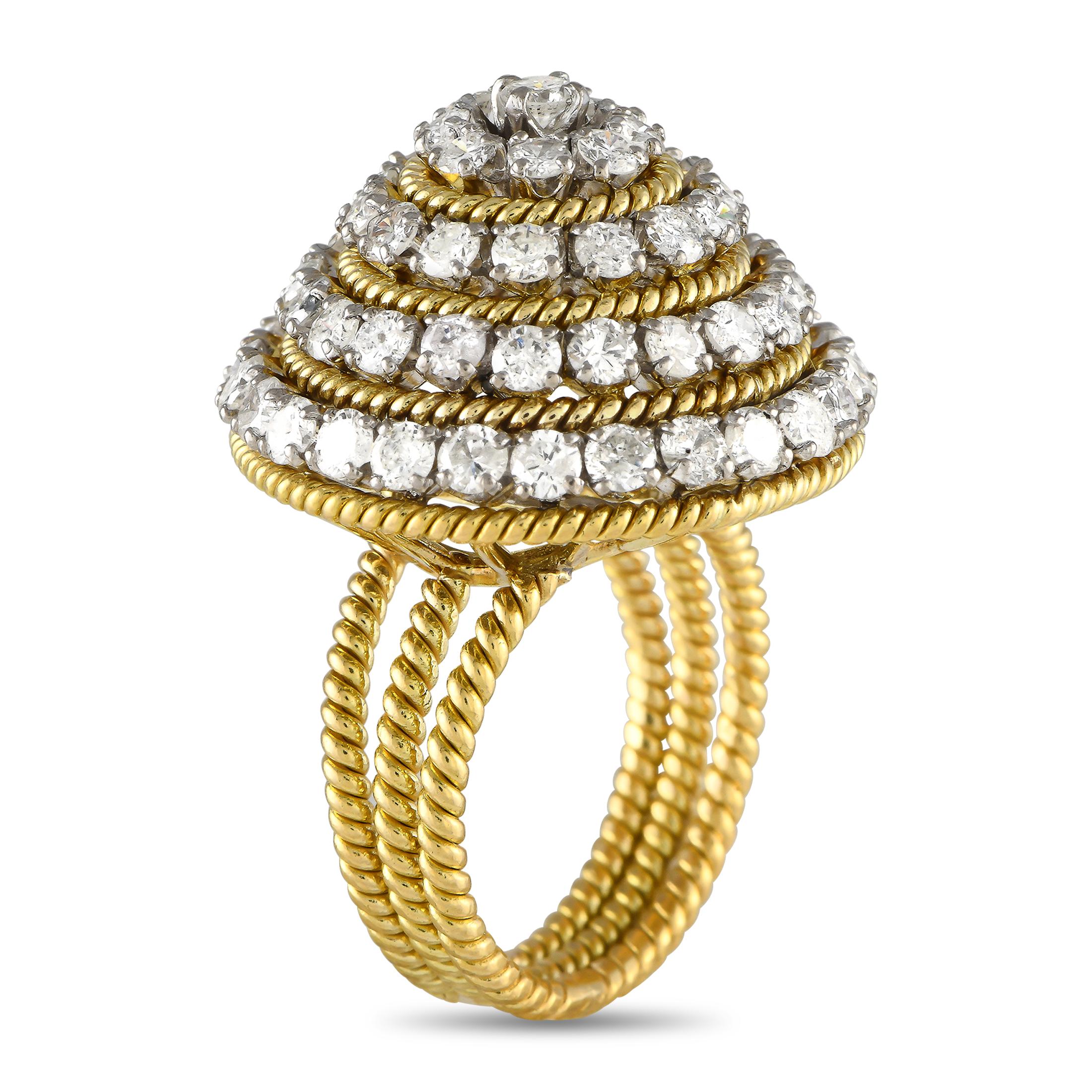 You'll be at the peak of style with this statement ring. It features a trio of rope-style bands topped with a mountain of diamonds. The pyramidal centerpiece features an alternating pattern of round diamonds and rope-style yellow gold trims. The