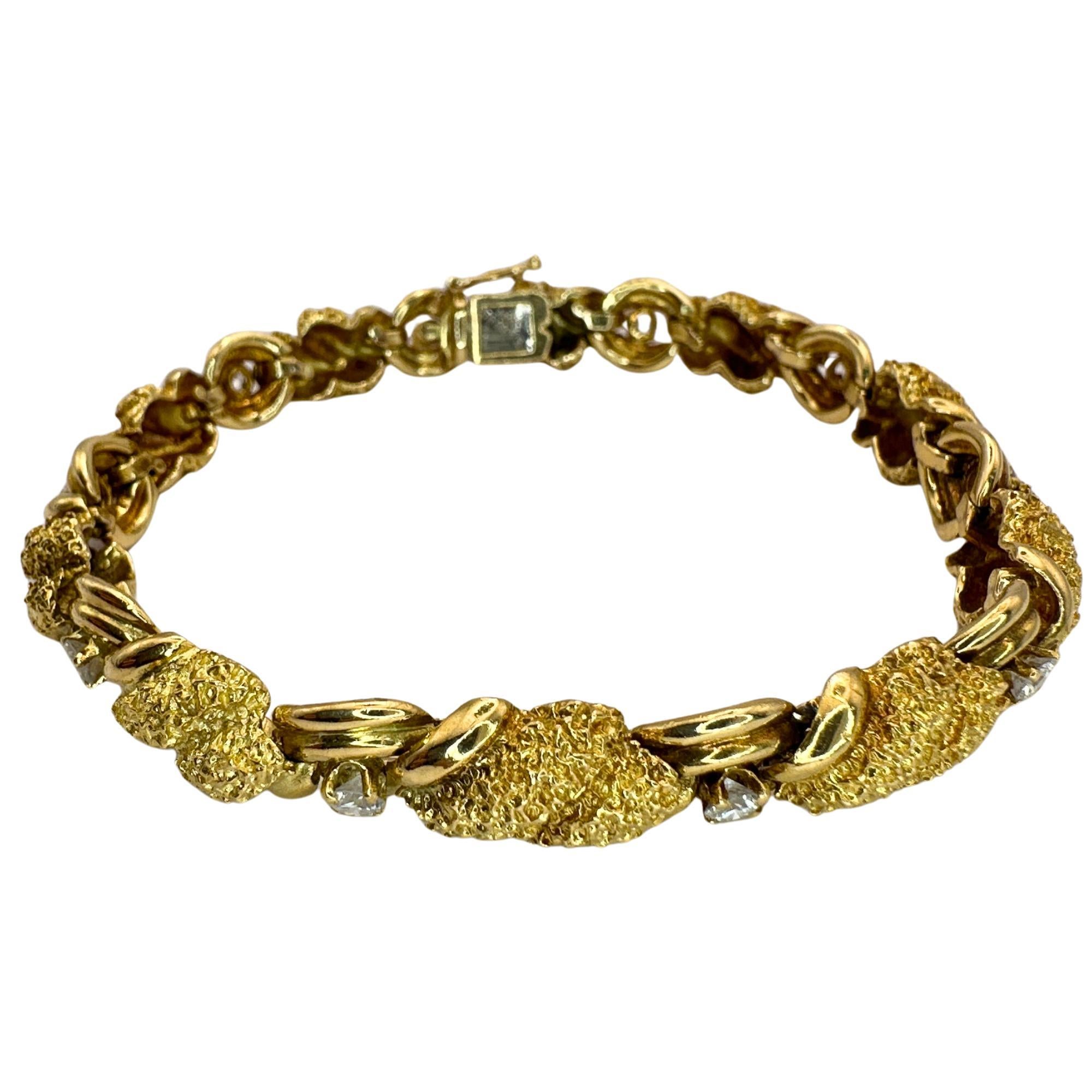 This vintage Tiffany & Co bracelet from the 1960's exudes elegance and quality. Crafted with 18k yellow gold and embellished with approximately 1.00 carats of diamonds, it radiates luxury and sophistication. In good condition with minimal wear, this