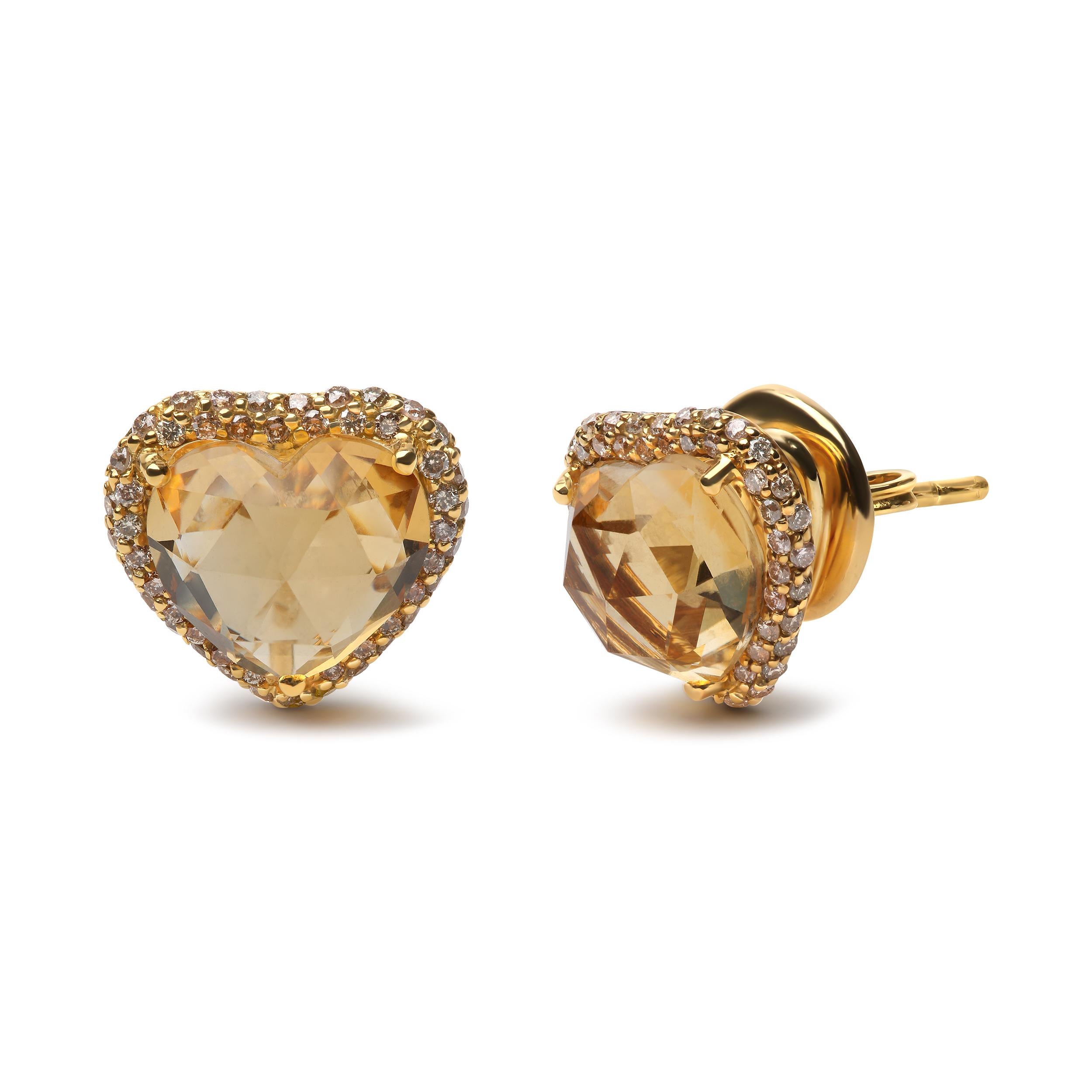 These dreamy 18k yellow gold stud earrings are so enchanting with a sunny heat-treated yellow 11x11mm heart-cut natural citrine gemstone in a 3-prong setting surrounded by a halo of round, heat-treated brown diamonds in prong settings. These warm,