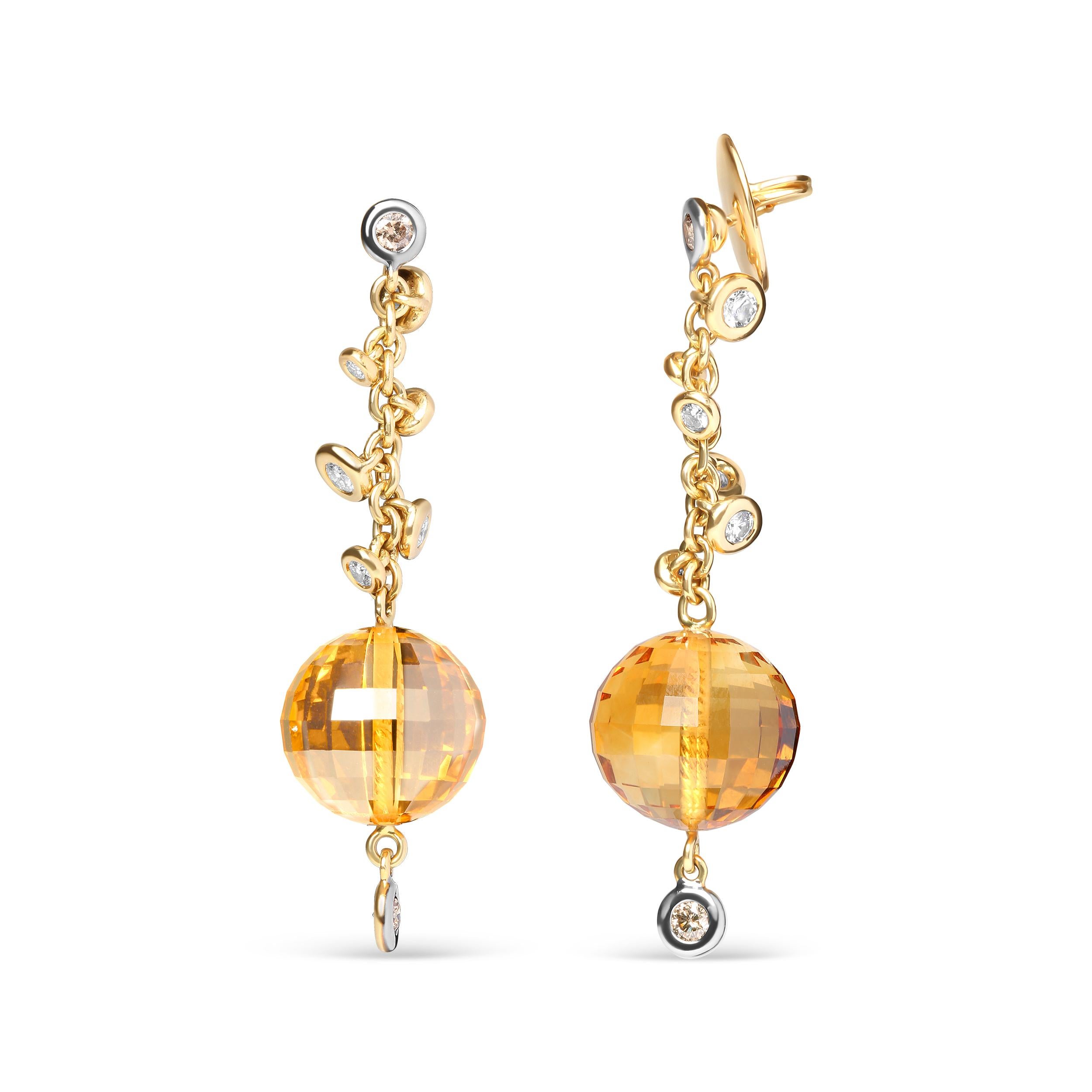 These 18k yellow gold dangle earrings possess a great movement that twinkles in the light as you move about and flash your style. Stationed at the top of the upper dangle and at the very bottom are two round heat-treated brown diamonds within secure