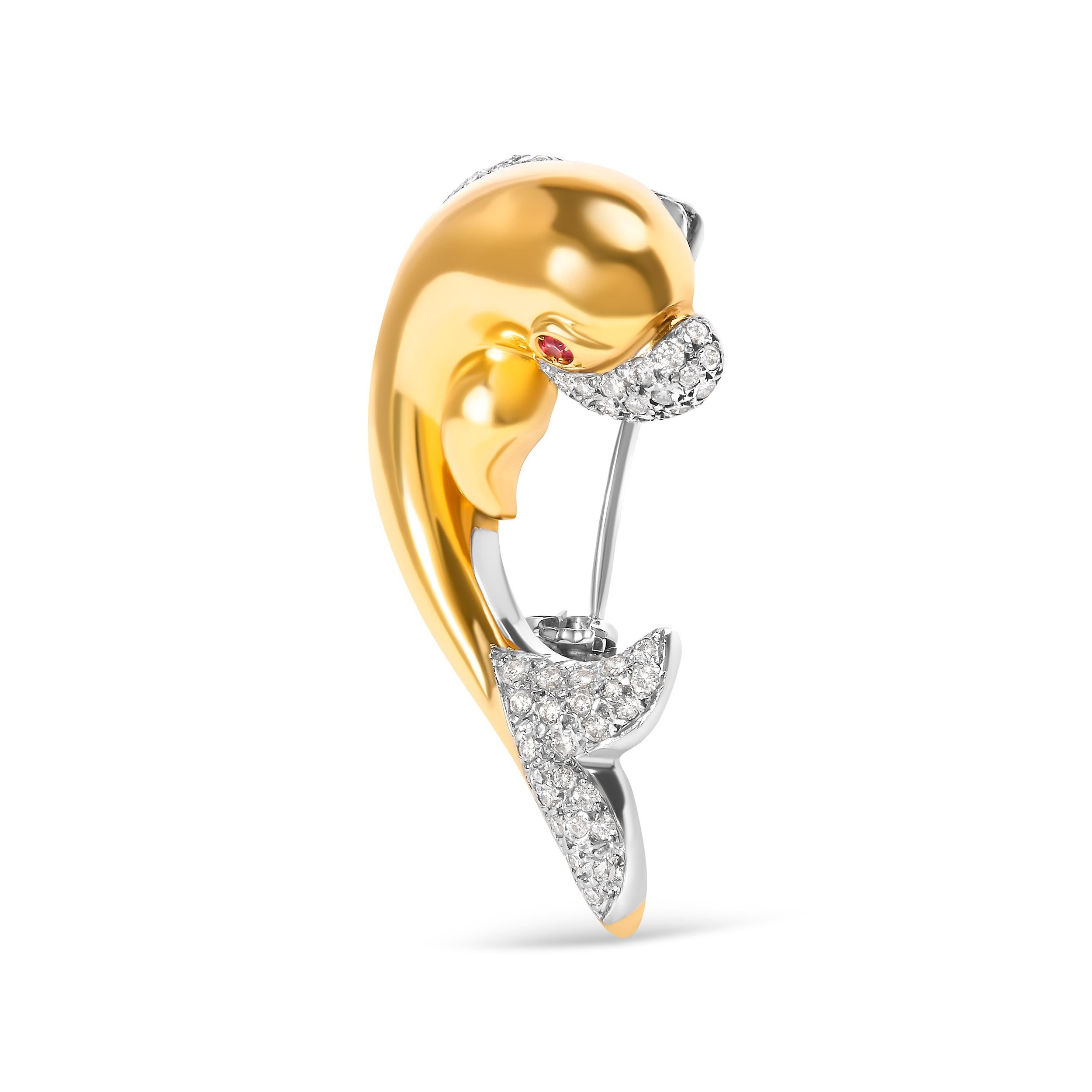 Introducing a masterpiece of elegance and charm, this 18K Yellow Gold Dolphin Brooch Pin is a true symbol of grace. Crafted with love and adorned with 56 round diamonds, this brooch sparkles with a total weight of 2/5 cttw. The H-I color and VS1-VS2