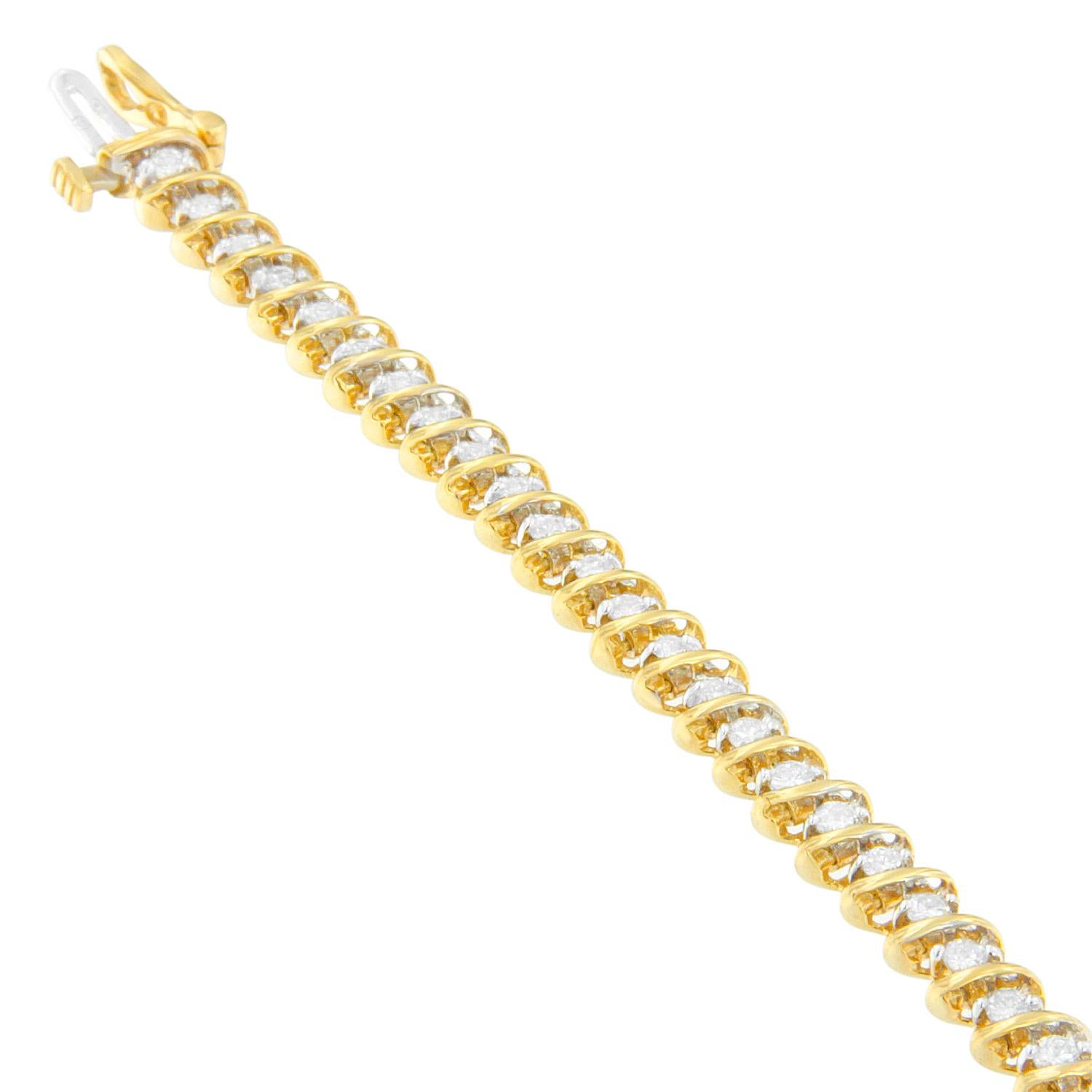 Bold meets brilliant! This unique bracelet is crafted with classic round cut diamonds nestled between raised bands of high shine 18 karat yellow gold to form a dazzling spiral effect for the woman who loves to stand out from the crowd. Packaging