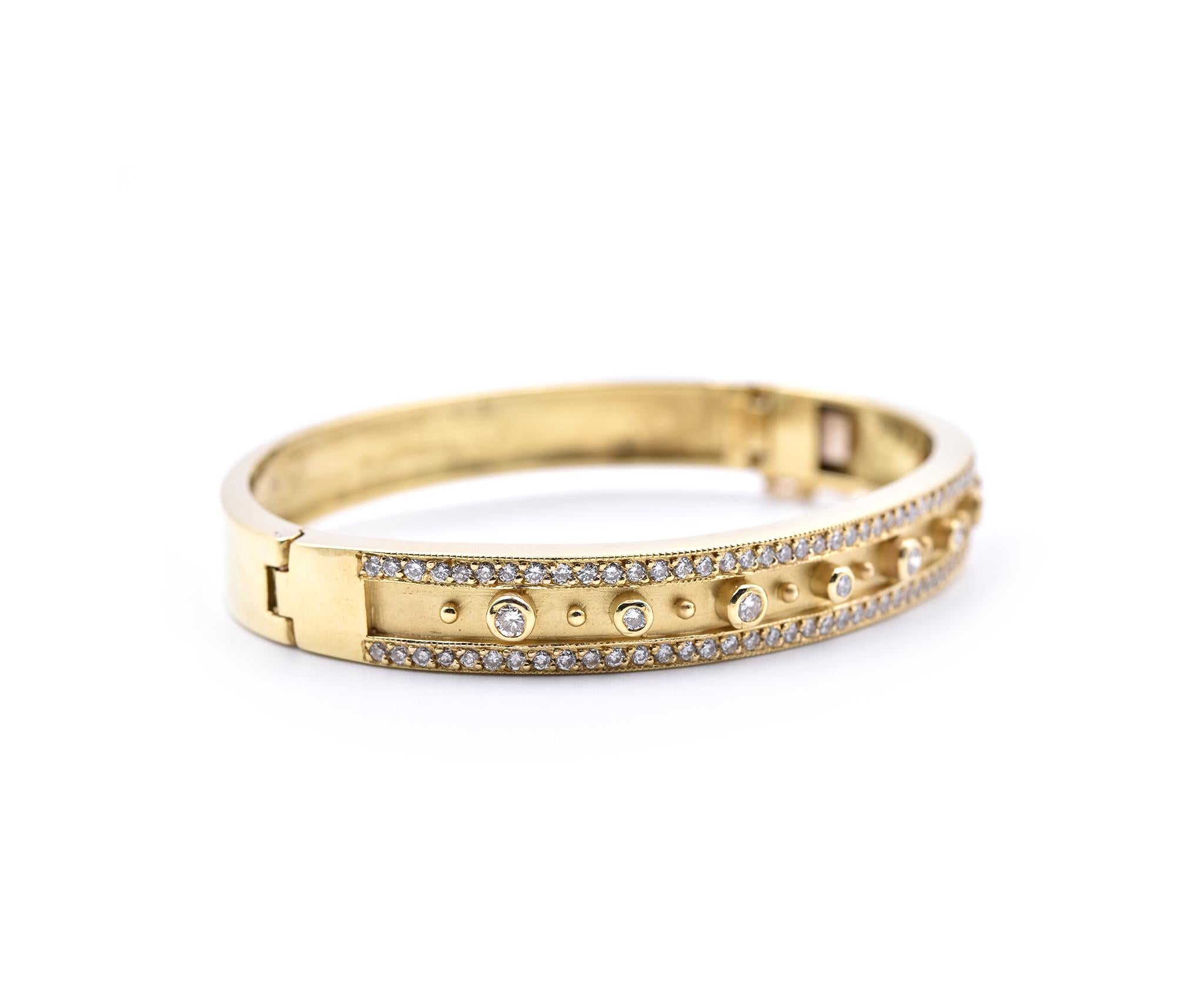 Designer: custom design
Material: 14k yellow gold
Diamonds: 111 round brilliant cuts = 2.00cttw
Color: H
Clarity: SI1
Dimensions: bracelet measures 7-inches long and 8.60mm in width
Weight: 38.55 grams
