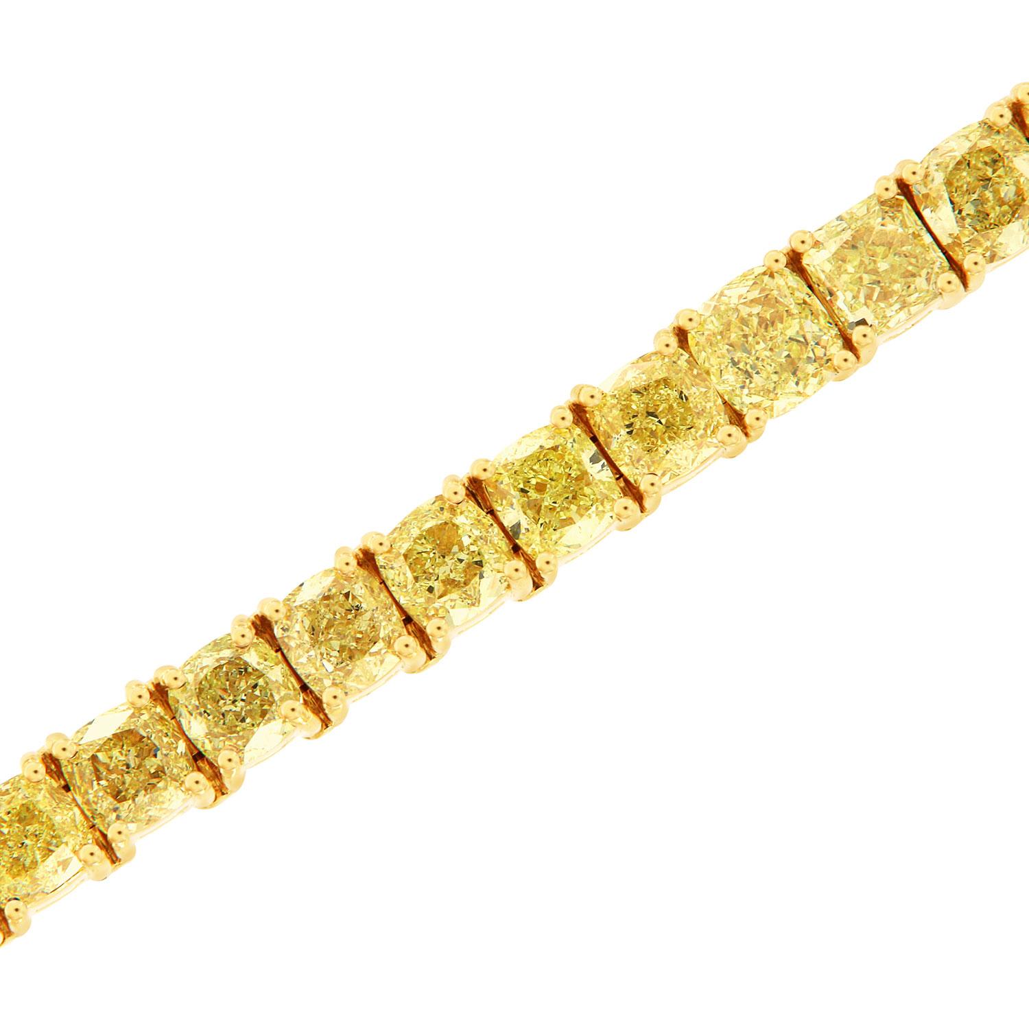 This one-of-a-kind handcrafted bracelet features 38 Cushion-shapes Yellow diamonds in a total weight of 20.5 carats. 
The diamonds size breakdown is:
Seven (7) Diamonds from 0.31 Carat to 0.38 Carat
Six (6) Diamonds from 0.40 Carat to 0.42