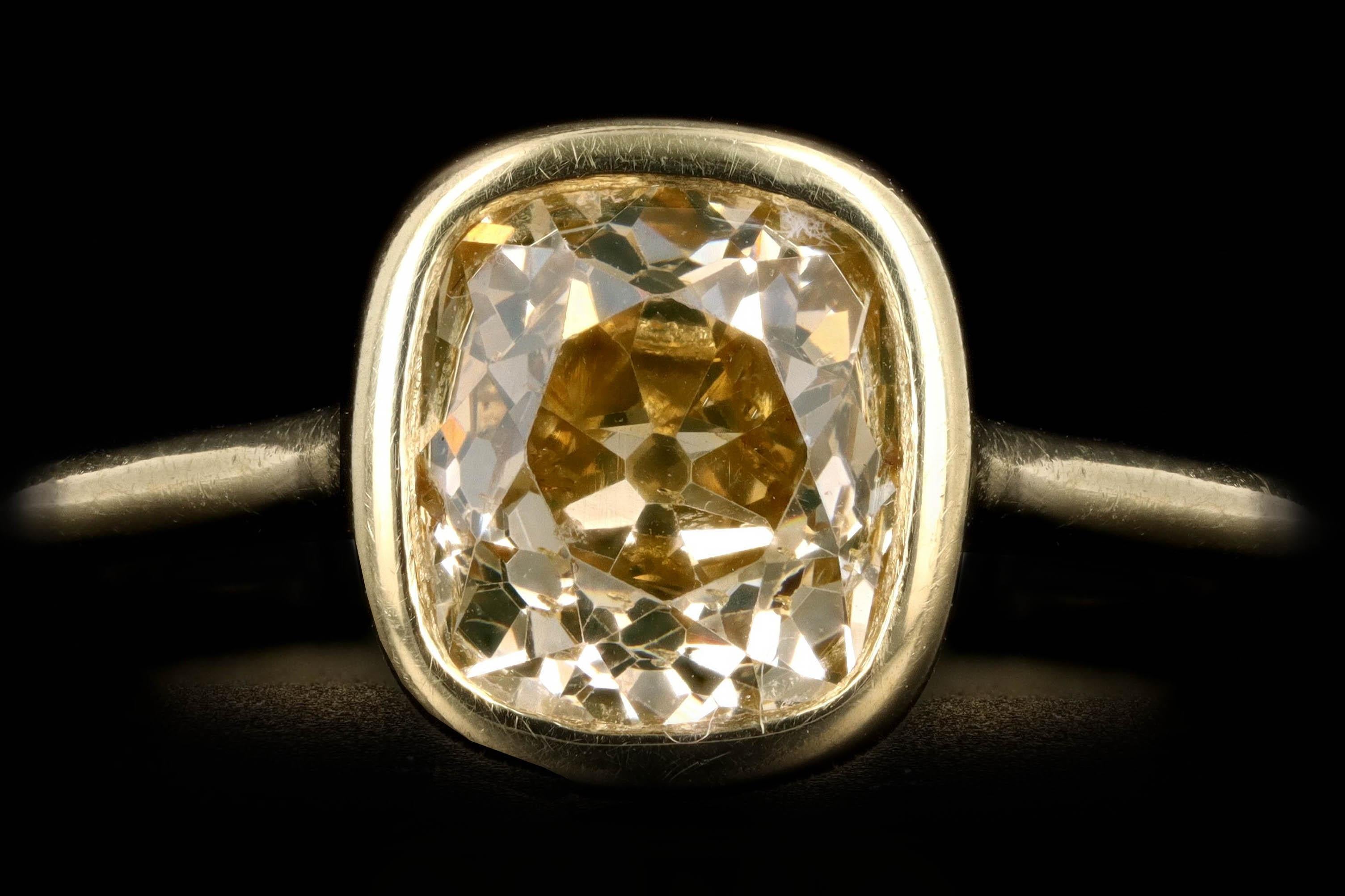 Era: Modern

Composition: 18K Yellow Gold

Primary Stone: Old Mine Cut Champagne Diamond

Carat Weight: Approximately 2.05 Carats

Color/Clarity: Champagne/SI2

Ring Weight: 3.3 Grams

Ring Size: 6

Item Barcode: 238944