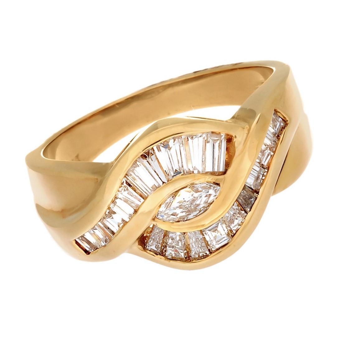 18K Yellow Gold Ribbon Style Marquise and Baguette Diamond Ring .
Set With 1-Marquise cut diamond and 21 Baguette cut diamonds to total 0.82 carats, and 1 Marquise Diamond 0.12Ct.
Total Weight  0.94 Carats 
Width: 11 mm
tapers to 3.5 mm
Size 6.5 