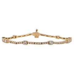 Bracciale tennis con stazione di diamanti in oro giallo 18K da 2,21 carati