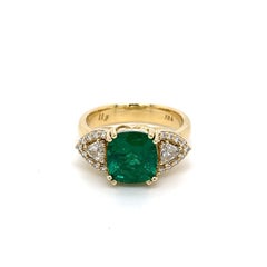 18k Yellow Gold 2.65 Carat Cushion Cut Emerald Ring with Trillion White Diamonds