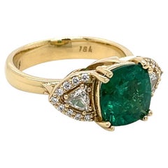 18k Yellow Gold 2.65 Carat Cushion Cut Emerald Ring with Trillion White Diamonds