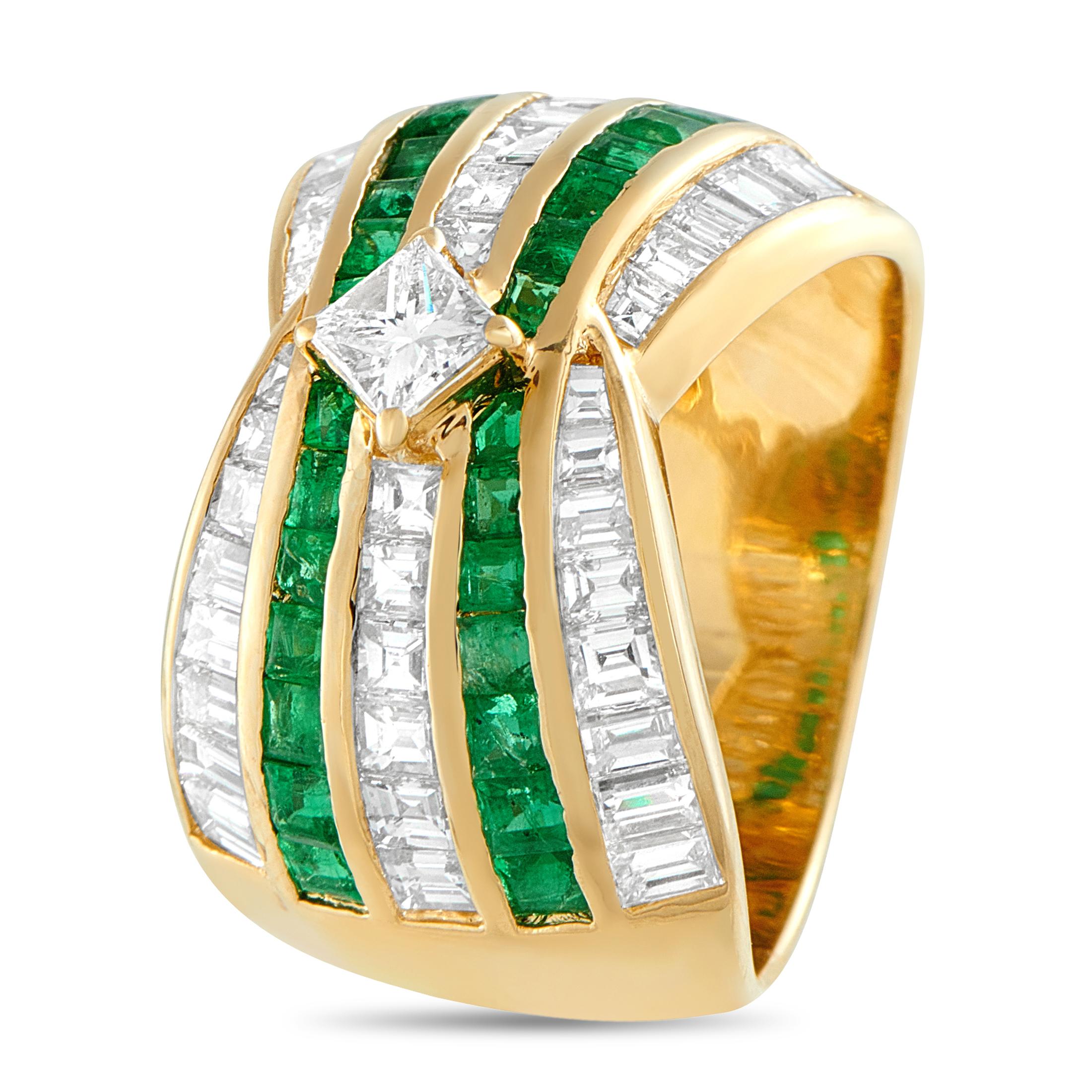 A statement ring that combines color, structure, and geometry. This 18K yellow gold ring is designed with a 10mm wide band lined with five rows of gemstones. Two feature vivid emeralds while the three have diamonds, all step-cut and channel set for