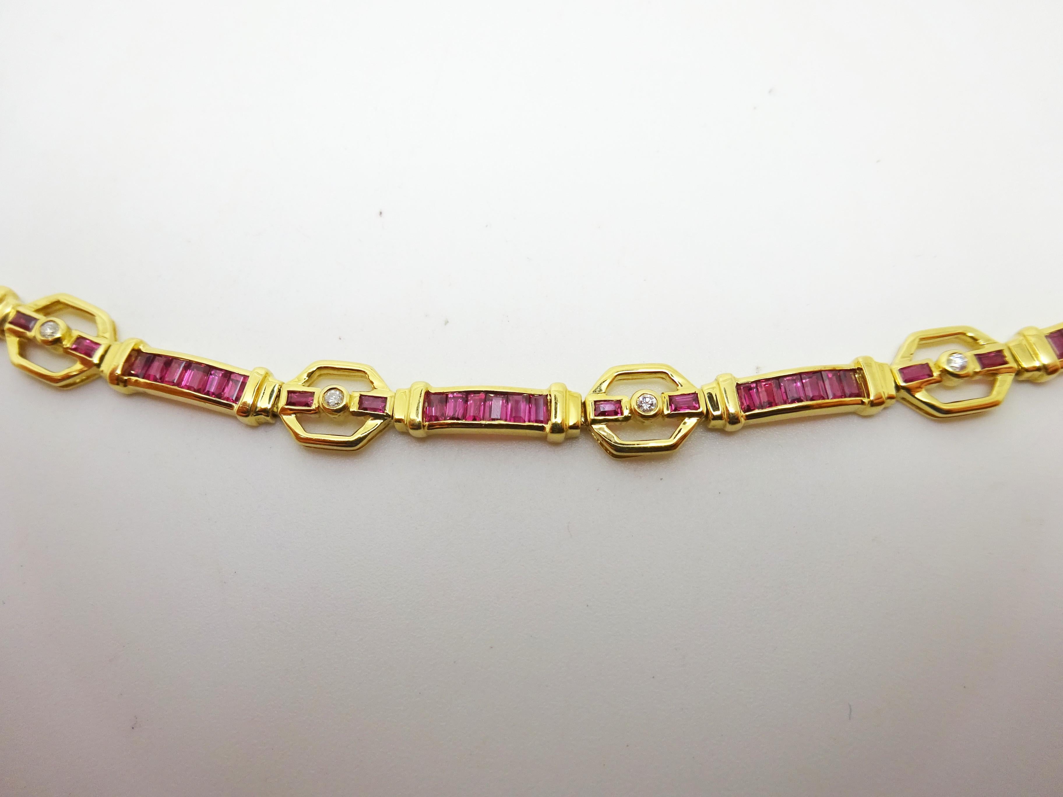 18k Yellow Gold 3 Carat Genuine Natural Ruby and Diamond Bracelet (#J3326)
18k yellow gold ruby and diamond bracelet featuring sixty-four rectangular step cut earth mined pinkish red rubies. The rubies are channel set and weigh 2.91 carats total.