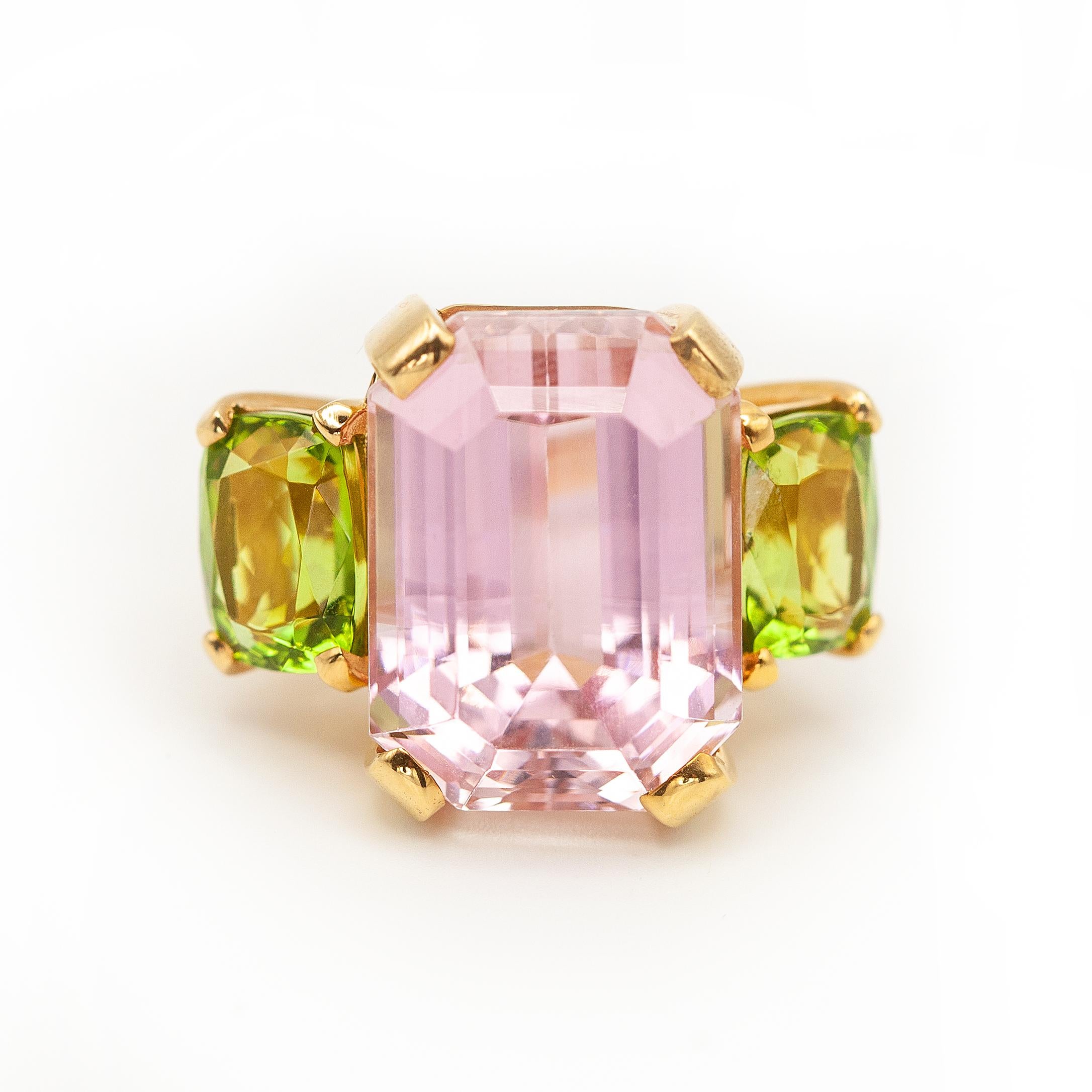 Vintage kunzite and peridot three stone cocktail ring crafted in 18K yellow gold 4-prong setting with a natural emerald cut pink kunzite approximate 30 carats and 2 cushion cut peridots

Ring size ~ US 7.25

Approximate Weight: 20.8
