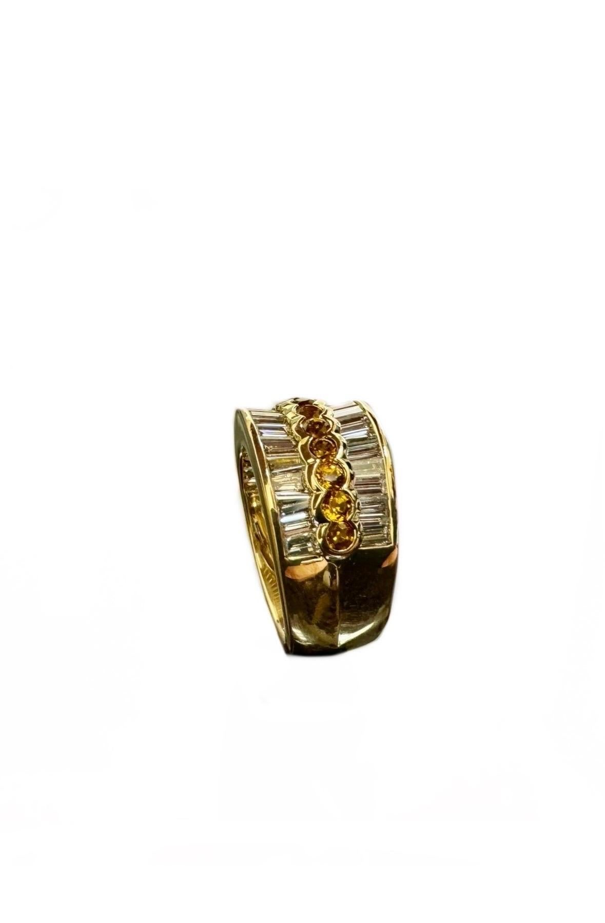 DeKara Design Collection 

Metal- 18K Yellow Gold, .750.  10.80 Grams.

Stones- 34 Baguette Diamonds G-H Color VS1 Clarity 2.27 Carats, 13 Round Yellow Sapphires, 1.07 Carats.

Size- 6 1/4.  Free Sizing.

Entirely Handmade 18K Yellow Gold Round