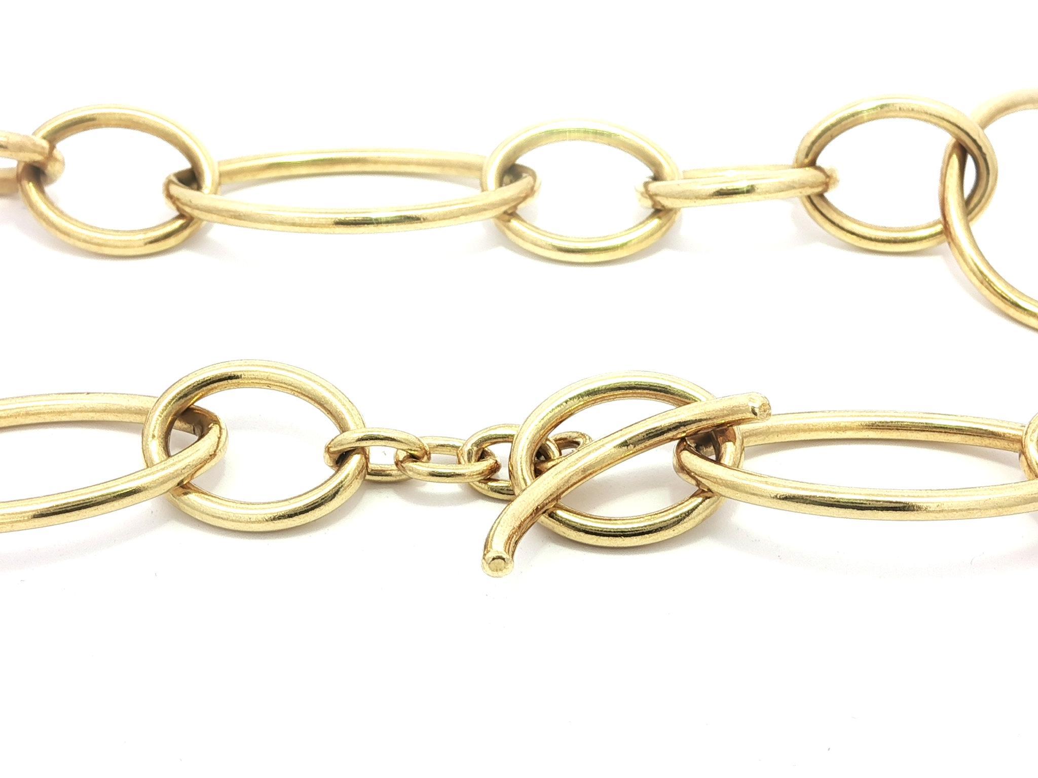 MATERIAL : Or jaune 18k massif 
Poids : 46,65 grammes
Type de chaîne : Maillon ouvert long
Longueur de la chaîne : 33,5 pouces (mesurée à côté de la règle)
Largeur de la chaîne : 9.6mm (0.37