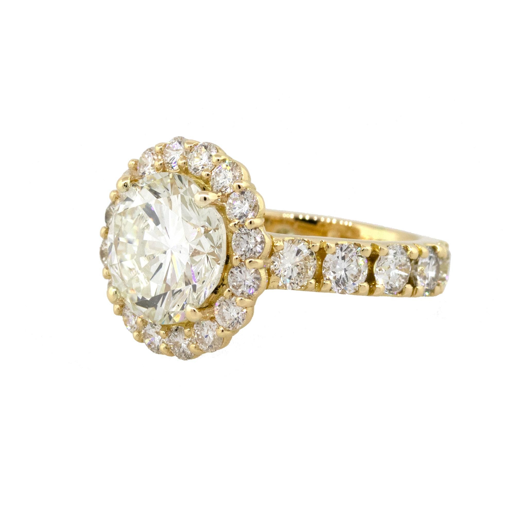 Material: 18k Yellow Gold
Center Diamond Details: 4.02ct Round Brilliant Diamond is K in color and VS2 in clarity
GIA Report Number: 2195825650
Adjacent Diamond Details: Approximately 1.85ctw of Round Cut Diamonds. Diamonds are G/H in color and SI