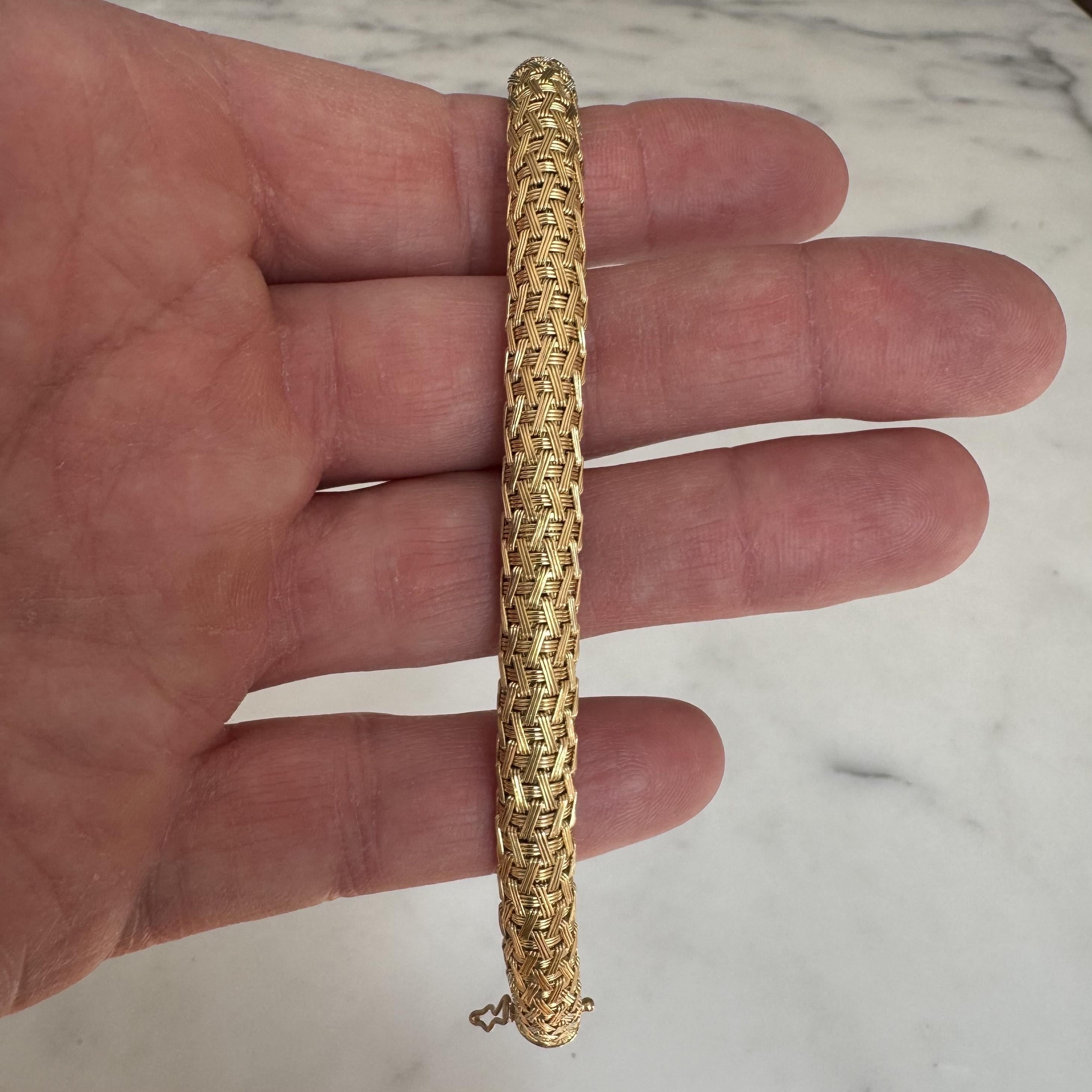 Condition:  Excellent Condition, Professionally Cleaned and Polished
Metal:  18k Gold (Marked, and Professionally Tested)
Weight:  40.1g
Length:  7.5 Inches
Width:  8mm
Closure:  Box Tab Insert with Two Safety Latches
Markings:  