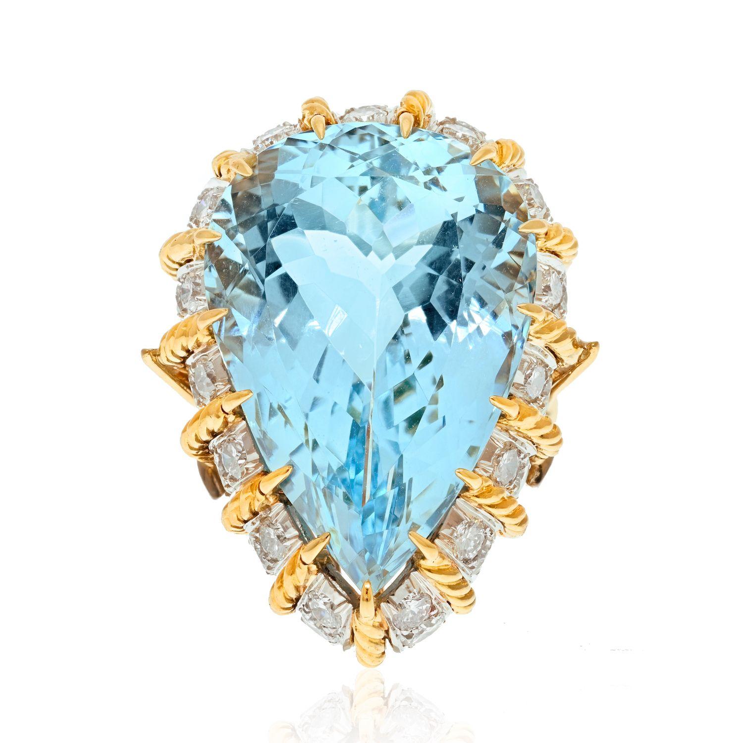 18K Yellow Gold 45 Carat Aquamarine And Diamond Fashion Cocktail Fine Estate Ring.
Extra large pear cut aquamarine mounted in a diamond and gold wire like frame. Spectacular size of the aquamarine is a perfect focal point of your hand. Be ready this