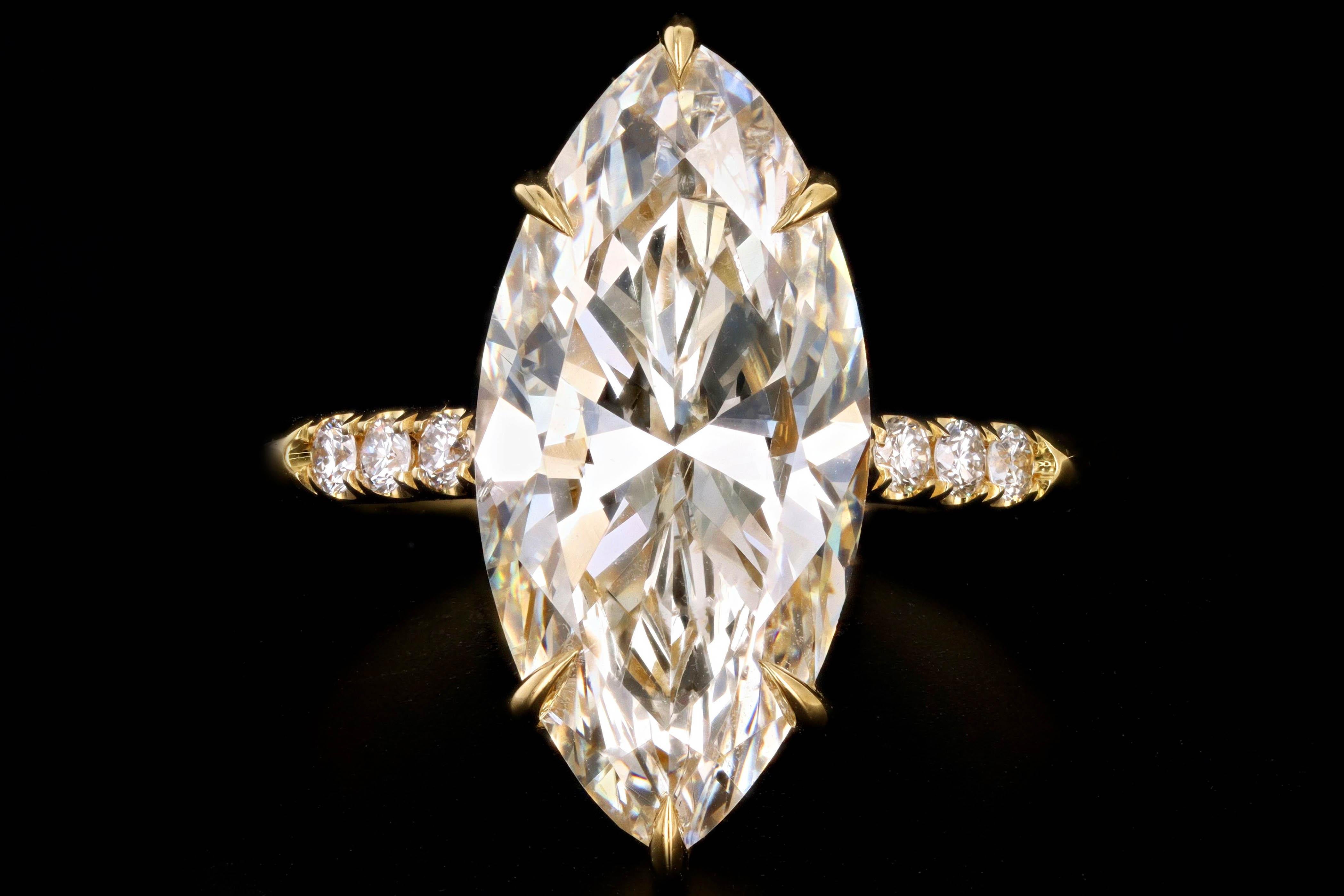 Era: New Vintage Inspired

Composition: 18K Yellow Gold

Primary Stone: Marquise Cut Diamond

Carat Weight: 4.63 Carats

Color/Clarity: K / I1

Accent Stone: Round Brilliant Diamonds

Carat Weight: Approximately .11 Carat Total

Color/Clarity: J/K -
