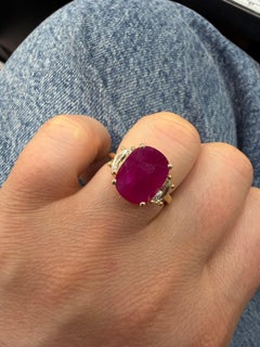 18K Yellow Gold 5.23 Carat Oval Ruby and Cadillac Diamond Three-Stone Ring