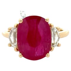 18K Yellow Gold 5.23 Carat Oval Ruby and Cadillac Diamond Three-Stone Ring