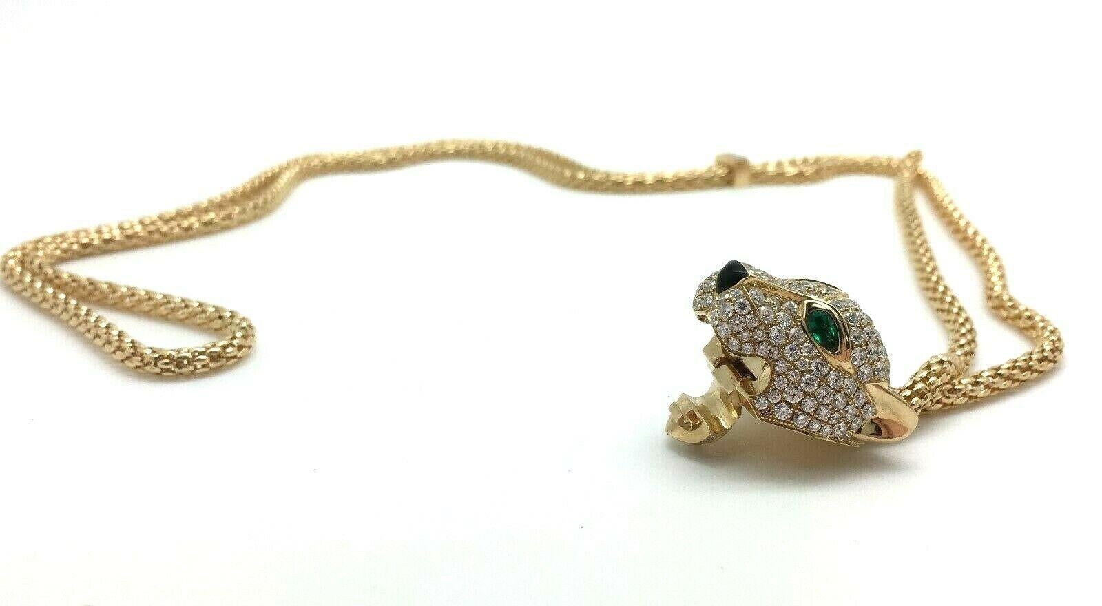 18K Yellow Gold 5.40 CTW Diamond & Emerald Adjustable Panther Necklace 40 Grams

The Necklace Contains Numerous Round Brilliant Cut Natural Diamonds, Weighing Approximately 5.40 Carat Total Weight.
Color Grade: F-G
Clarity Grade: VVS-VS1

There Are