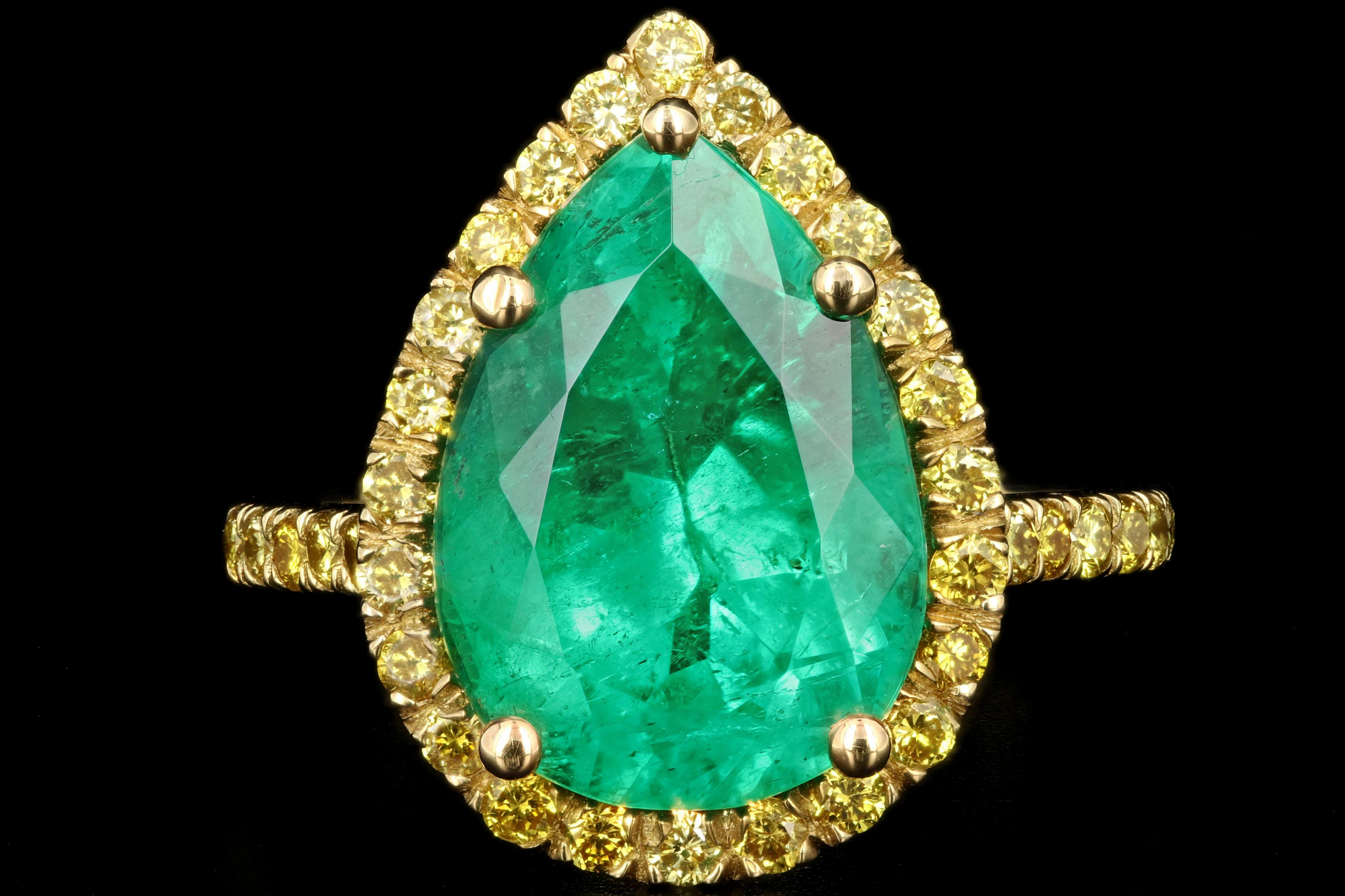Era: Modern

Composition: 18K Yellow Gold

Primary Stone: Oval Cut Colombian Emerald

Carat Weight: 5.92 Carats

Accent Stone: Round Diamonds

Color: Vivid Yellow

Clarity: Vs1/2

Carat Weight: Approximately .75 Carats

Total Carat Weight:
