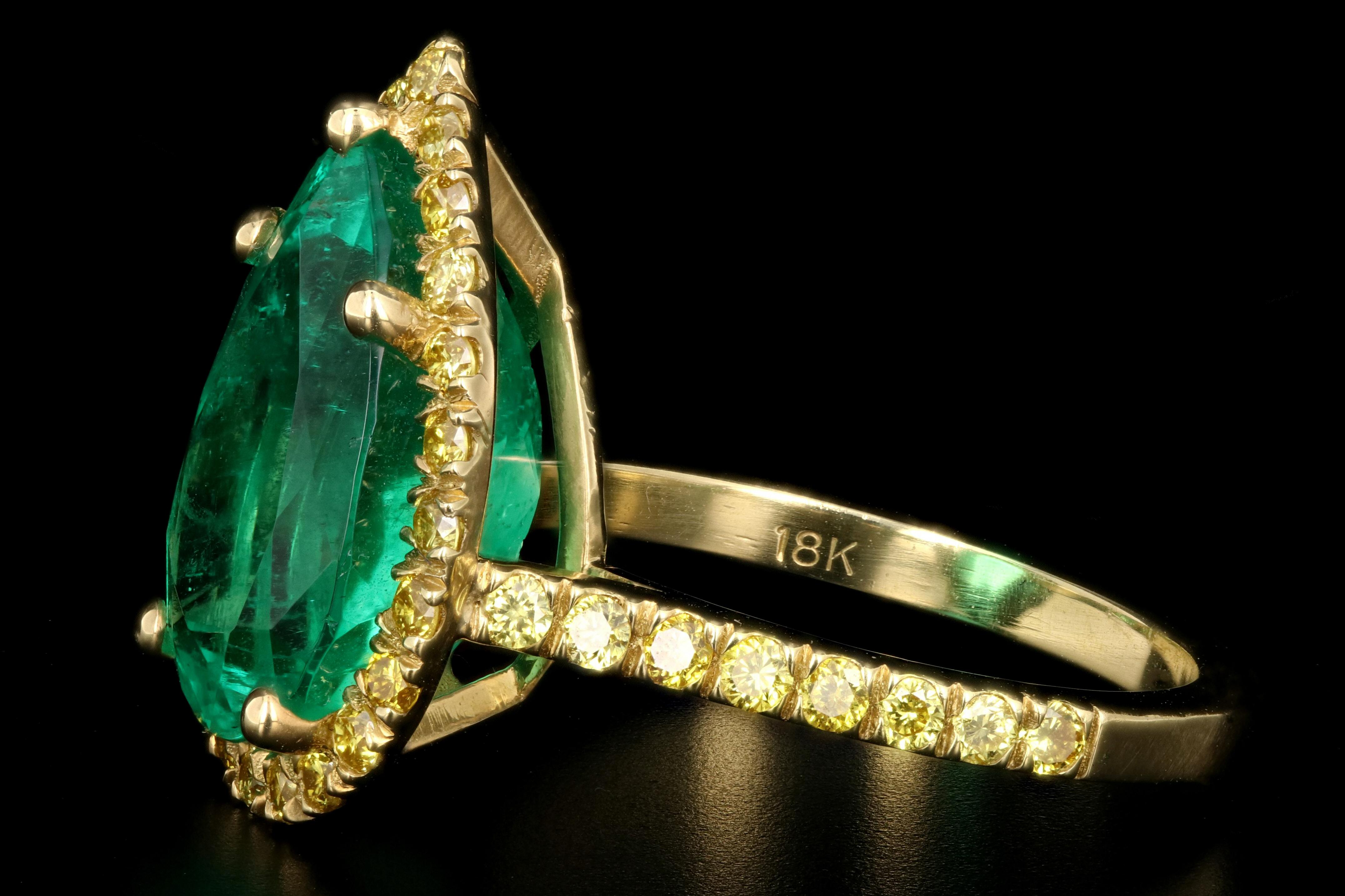 Pear Cut 18 Karat Yellow Gold 5.92 Carat Colombian Emerald and Vivid Yellow Diamond Ring