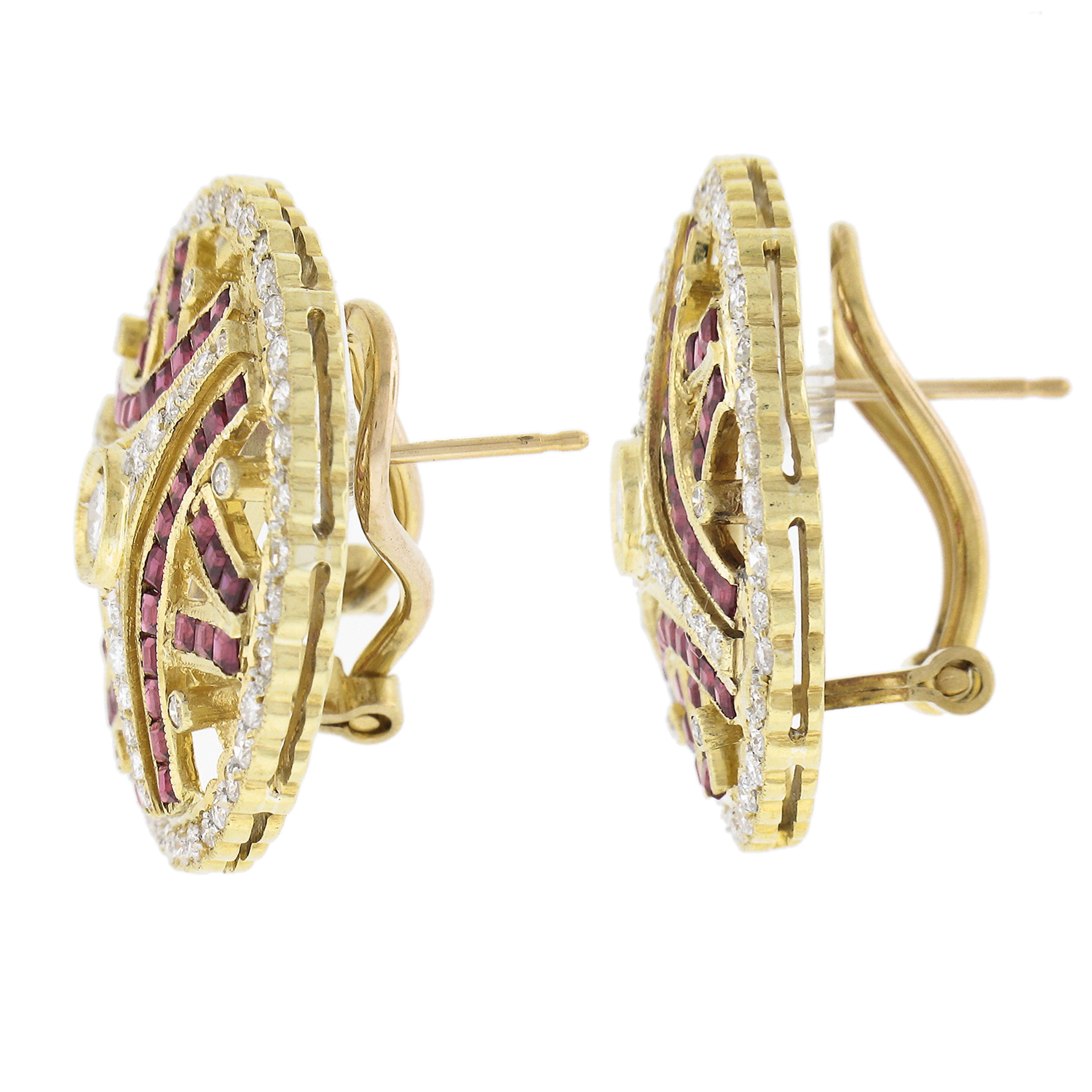 Round Cut 18K Yellow Gold 5ctw Calibre Ruby & Diamond Open Work Round Omega Back Earrings For Sale