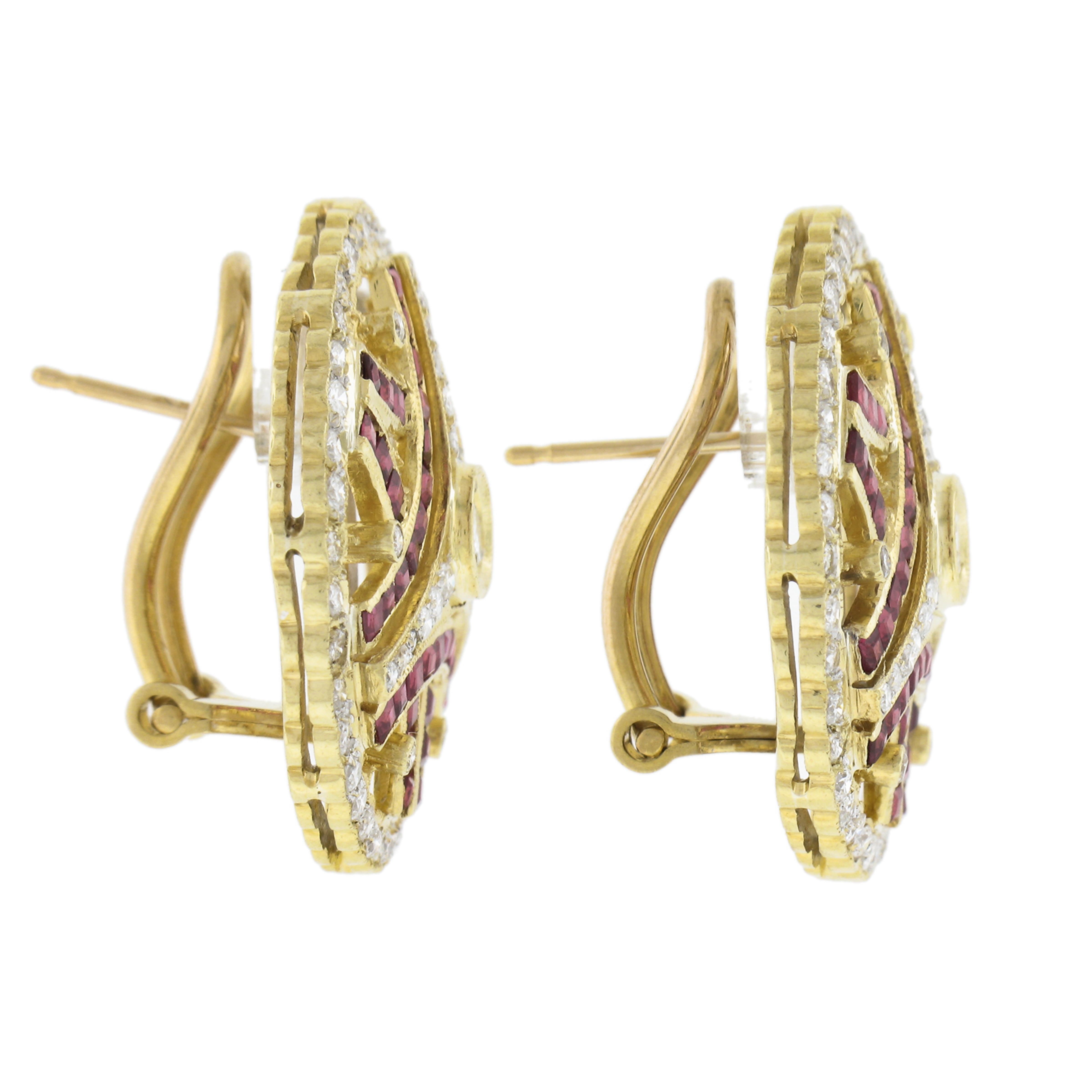 18K Yellow Gold 5ctw Calibre Ruby & Diamond Open Work Round Omega Back Earrings In Excellent Condition For Sale In Montclair, NJ