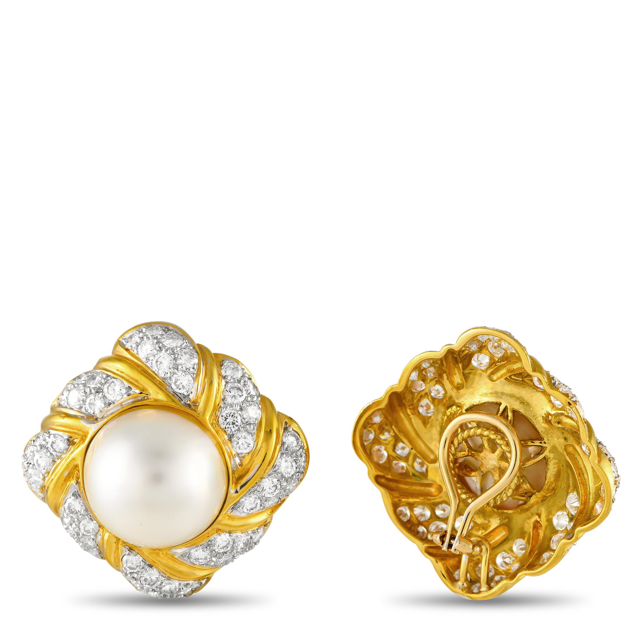 These breathtaking earrings are designed to make a statement. Crafted from 18K Yellow Gold, the center of each earring is accented by an exquisite Mobe Pearl. Inset Diamond accents with a total weight of 6.12 carats allow them to effortlessly