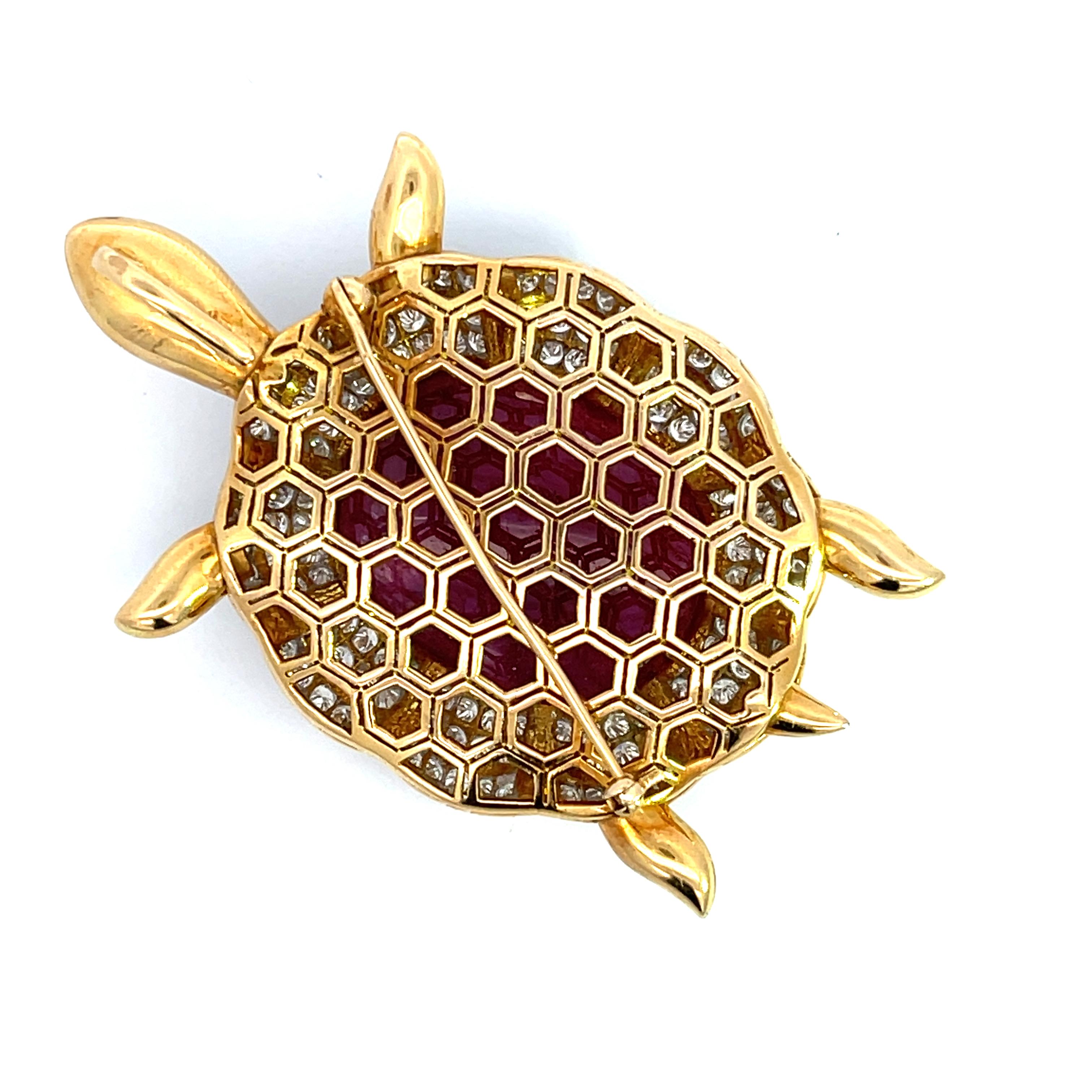 Introducing our exquisite 18K Yellow Gold 6.12ctw Diamond and 44/1ctw Natural cat's Eye Ruby Pendant/Brooch, a dazzling addition to your jewelry collection. An Impressive piece of jewelry, covered with diamonds will definitely make a statement. Made