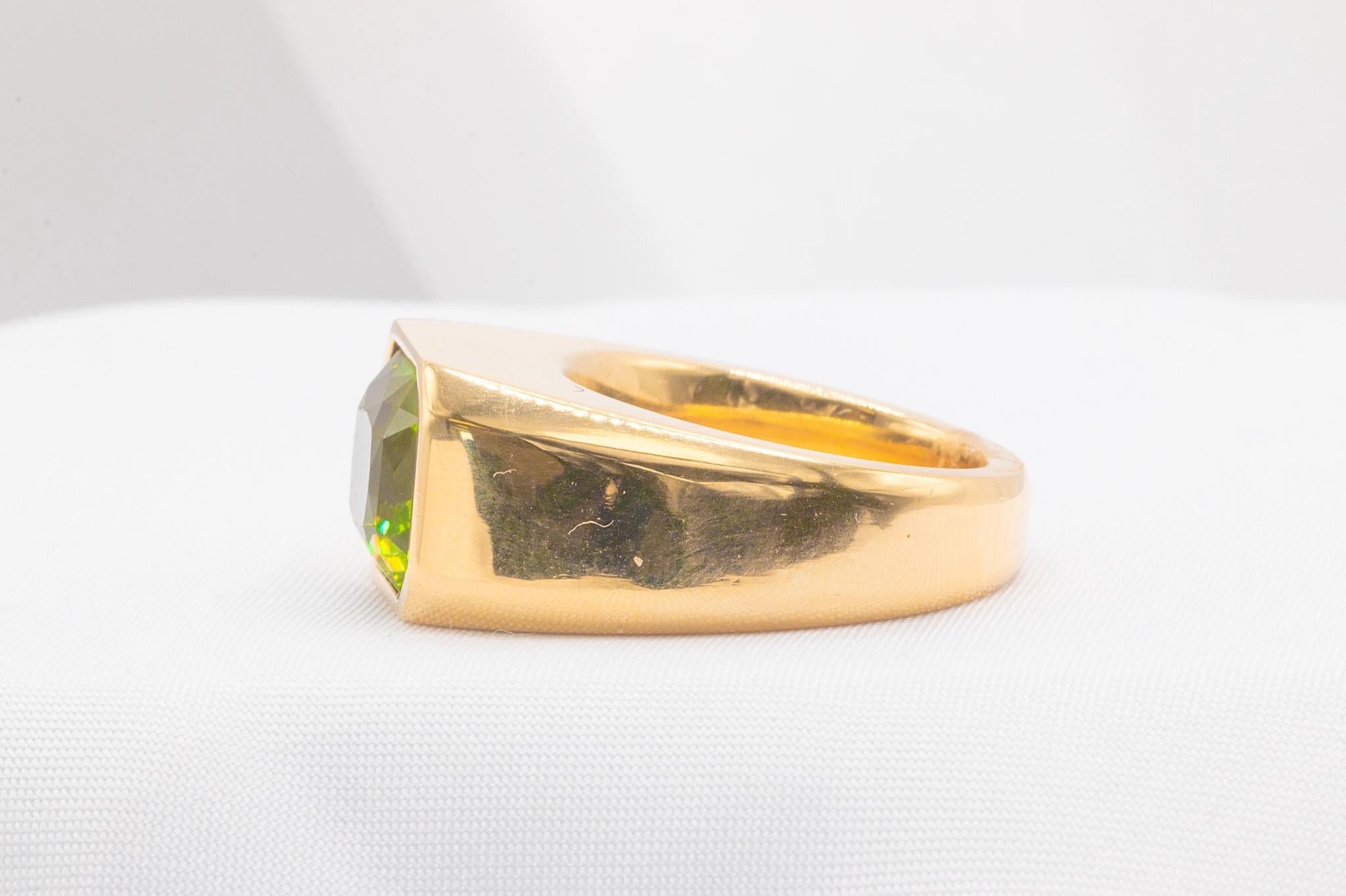 Elevate your style with this stunning light green peridot gemstone ring, crafted by Tayma Fine Jewelry. The 6.43-carat mixed radiant cut peridot is exceptionally clean and sits beautifully in a bezel setting, making a bold and elegant statement