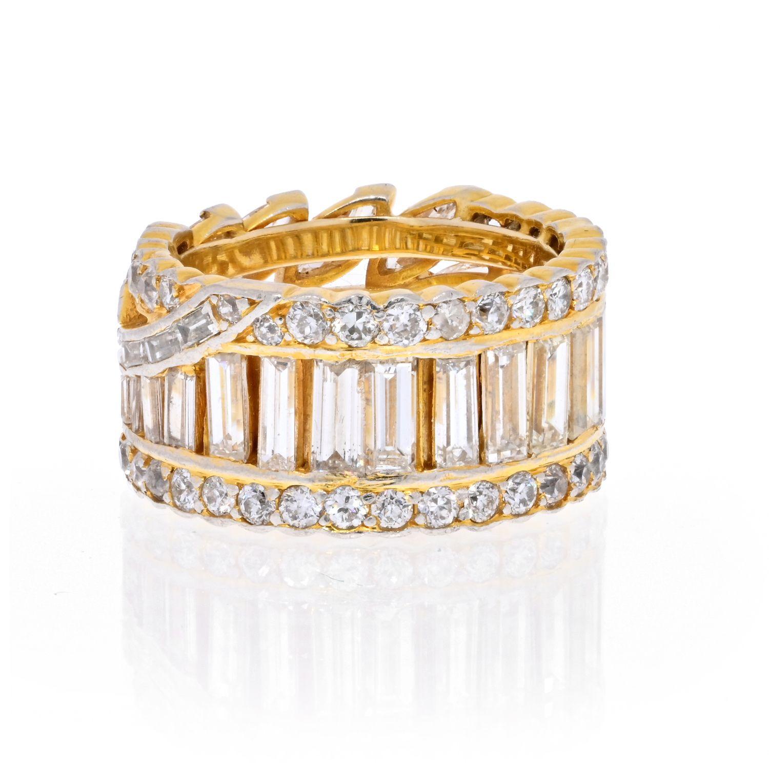 18K Yellow Gold round, marquise and baguette vintage eternity band. 7.00cts worth of diamonds. Diamonds are set all the way around, the fron tof the band with a geometric floral style and the back with straight cut baguettes framed by round cut