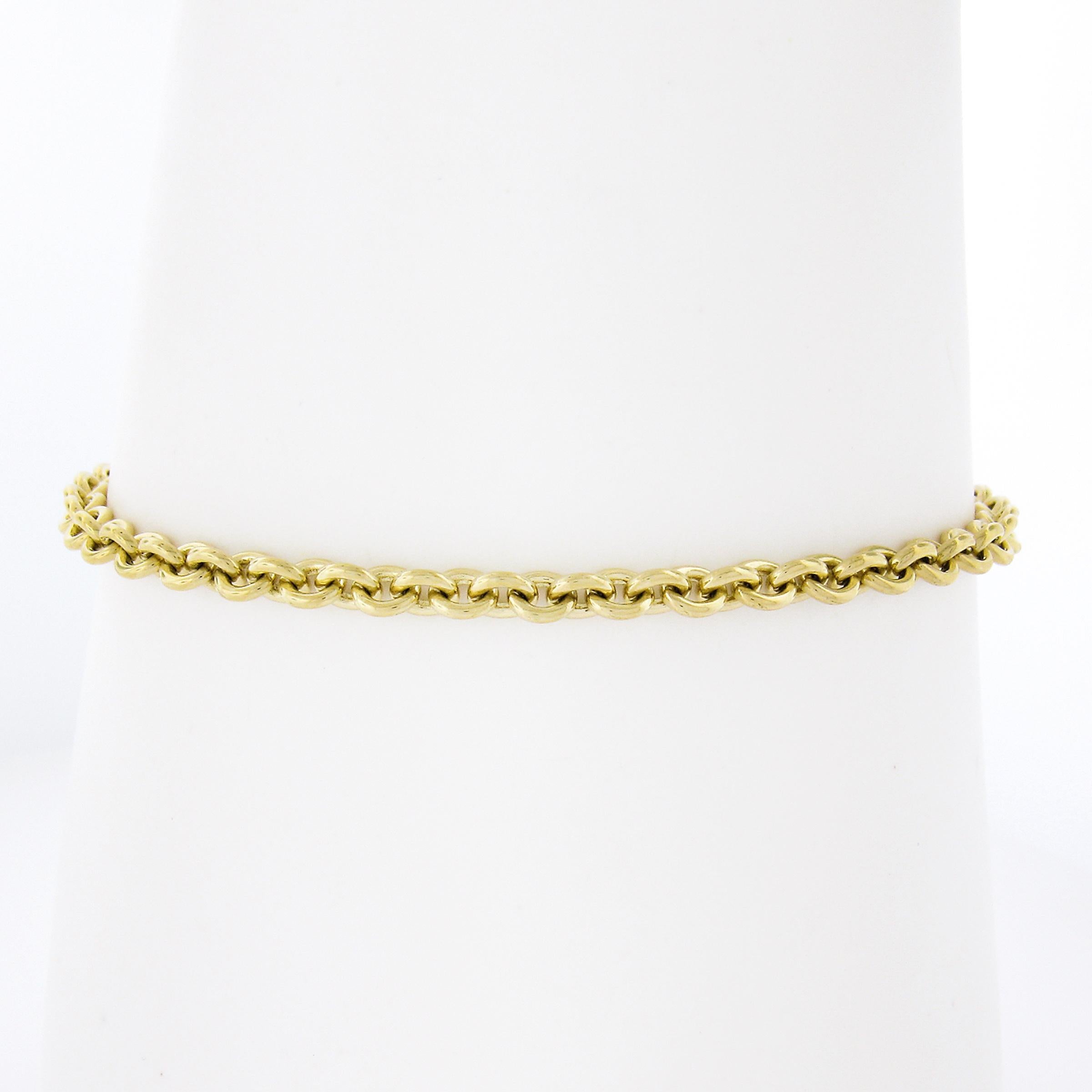 Material: 18K Solid Yellow Gold 
Weight: 9.81 Grams
Chain Type: Open Round Link
Chain Length:	Will comfortably fit up to a 7 Inch wrist
Clasp: Lobster Claw Clasp
Width: 2.4mm
Condition: Excellent condition!
Stock Number: MK-69050133-23120112-EY