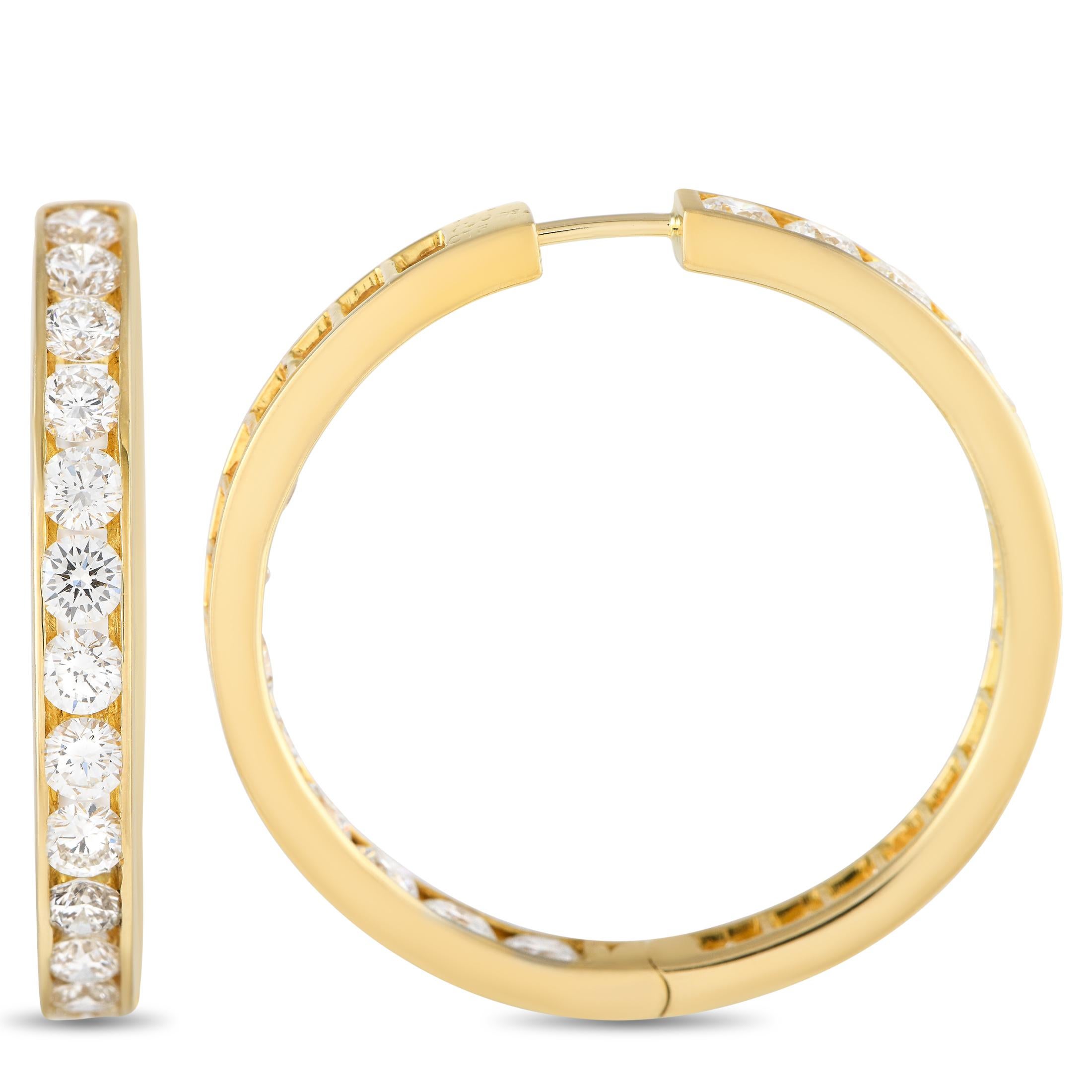 Shine bright with these diamond earrings. These ear sparklers are dripping in 7.20 carats of round diamonds, arranged in a stylish inside-out setting on 18K yellow gold hoops.Offered in estate condition, these 18K Yellow Gold 7.20ct Diamond