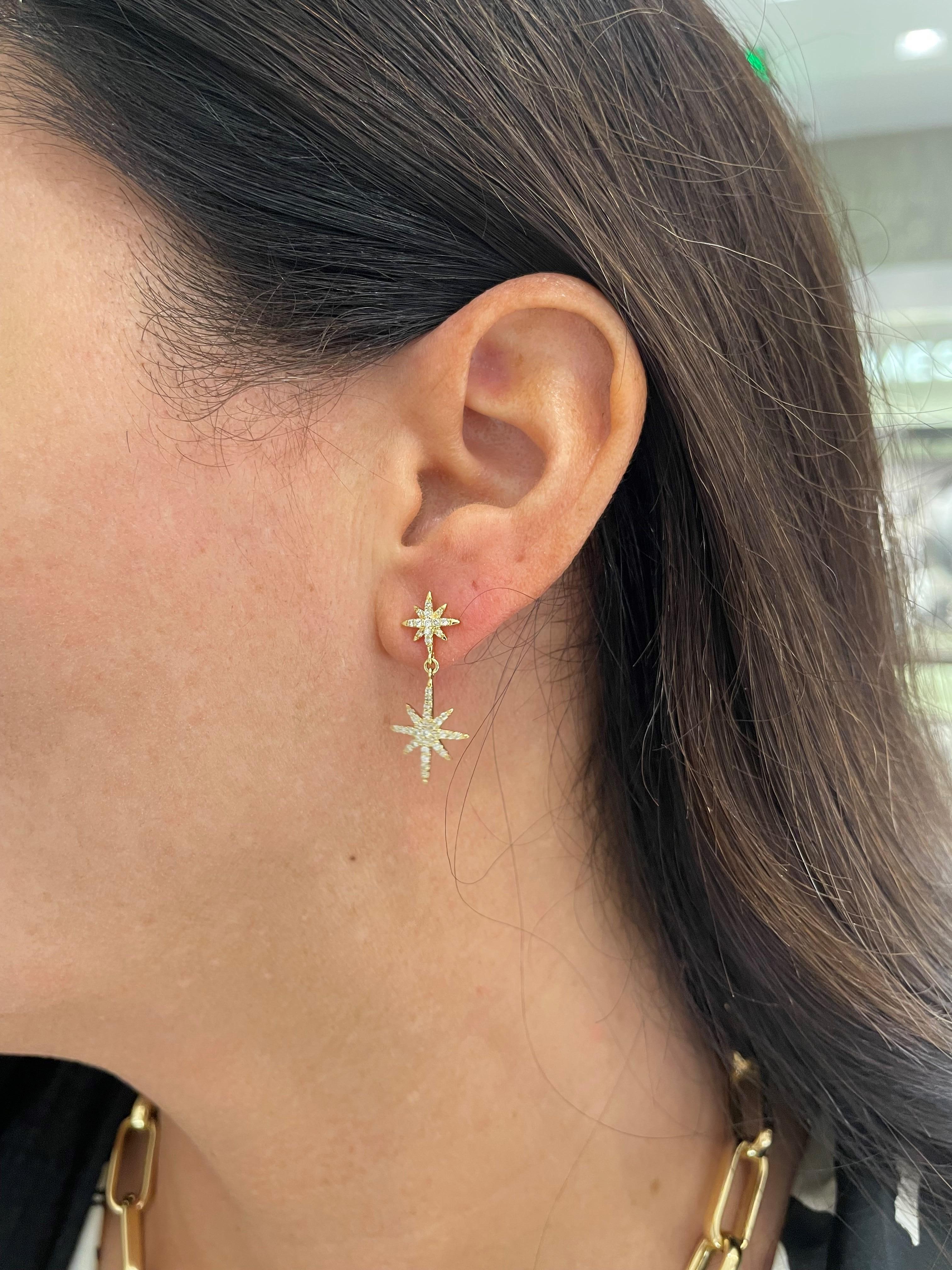 From the Eiseman Collection, 18 karat yellow gold 8 point star drop earrings featuring pave set round brilliant cut diamonds with a combined weight of 0.50 carats. These earrings feature a post and friction back closure and a polished finish.
