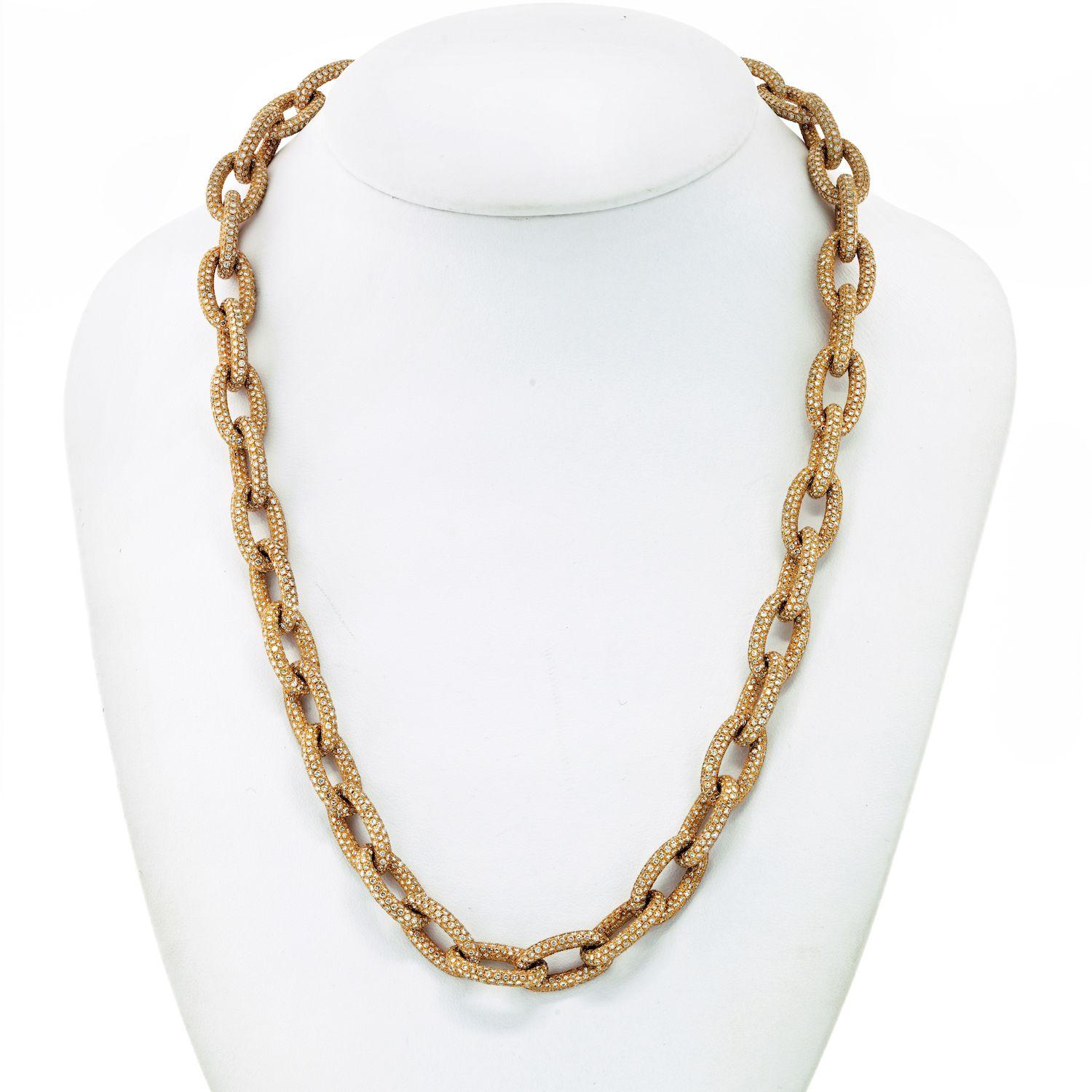 An 18k yellow gold long chain of oval textured linking, decorated with round brilliant-cut diamonds of approx. 85 carats. 
Diamond Quality: F-G color, VS-SI clarity.
The necklace is 24 inches long. 