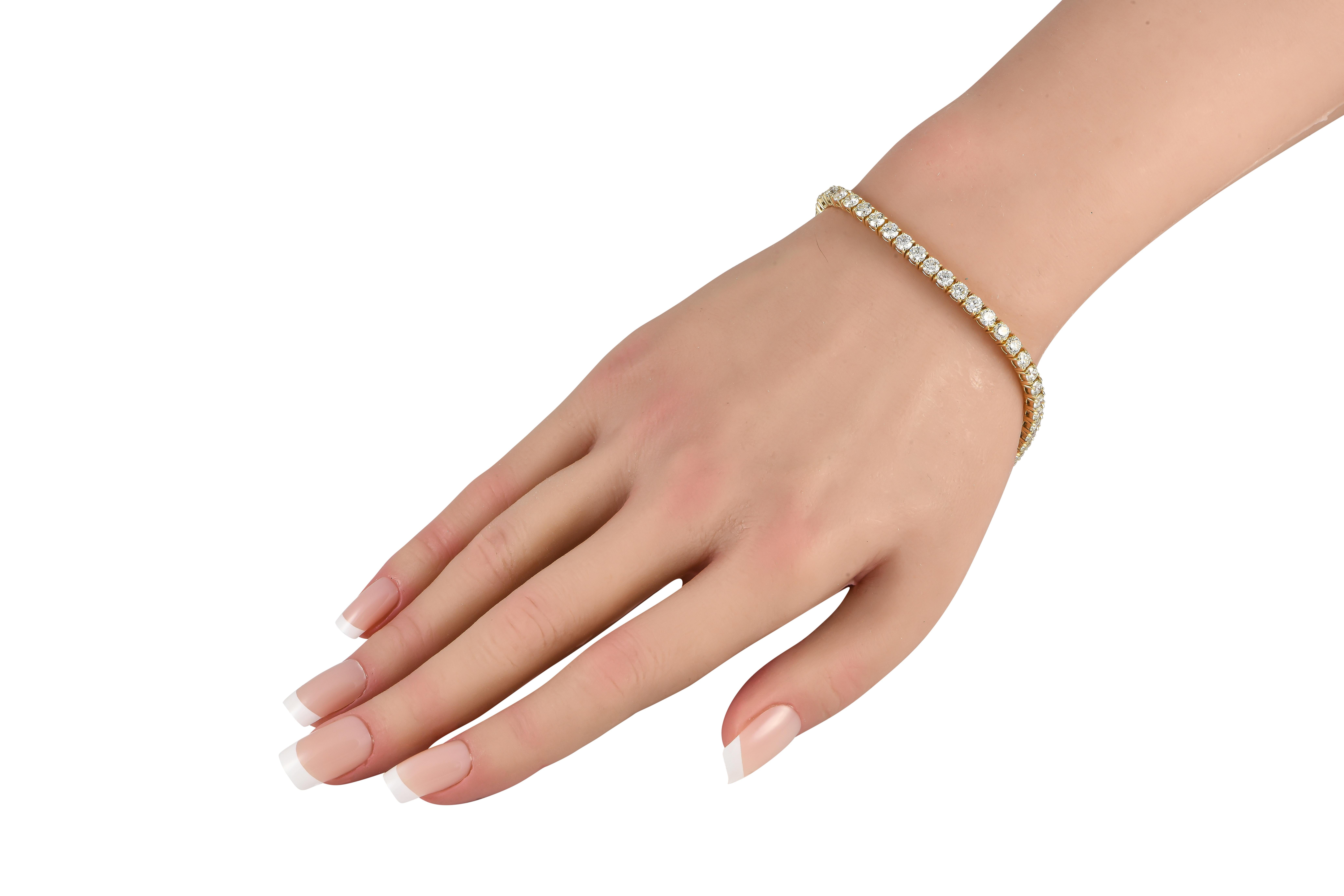 This 18K Yellow Gold tennis bracelet is an elegant accessory that will never go out of style. The simple, sophisticated design is elevated by a series of sparking Diamonds totaling 8.81 carats. Versatile and incredibly easy to wear, it measures 7.5
