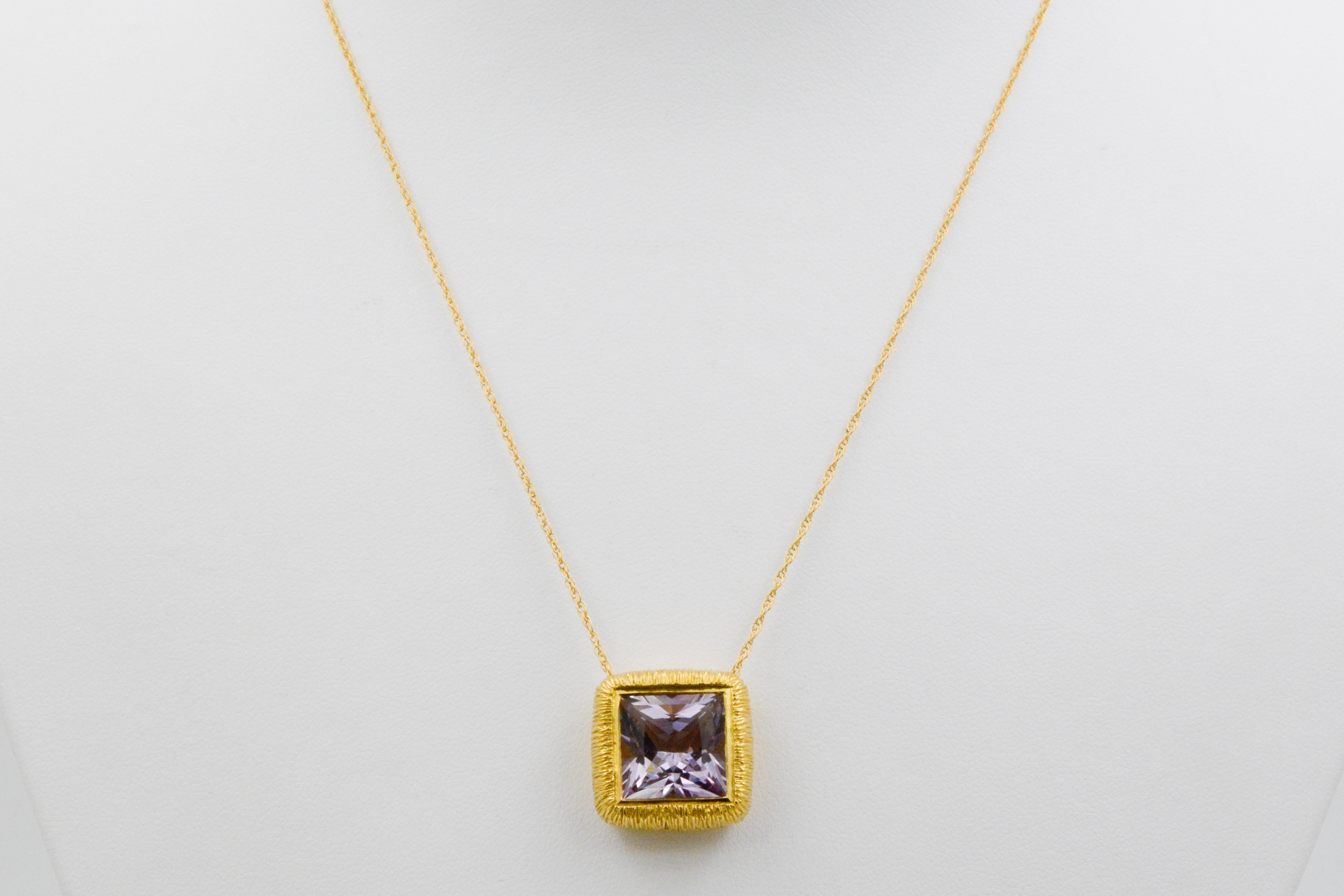 It's hip to be square if you are an 8.98 carat square brilliant cut lavender Amethyst. This exquisite Amethyst is expertly bezel set in 18 karat yellow gold with brushed grooves, and suspended on an 18 inch length chain.