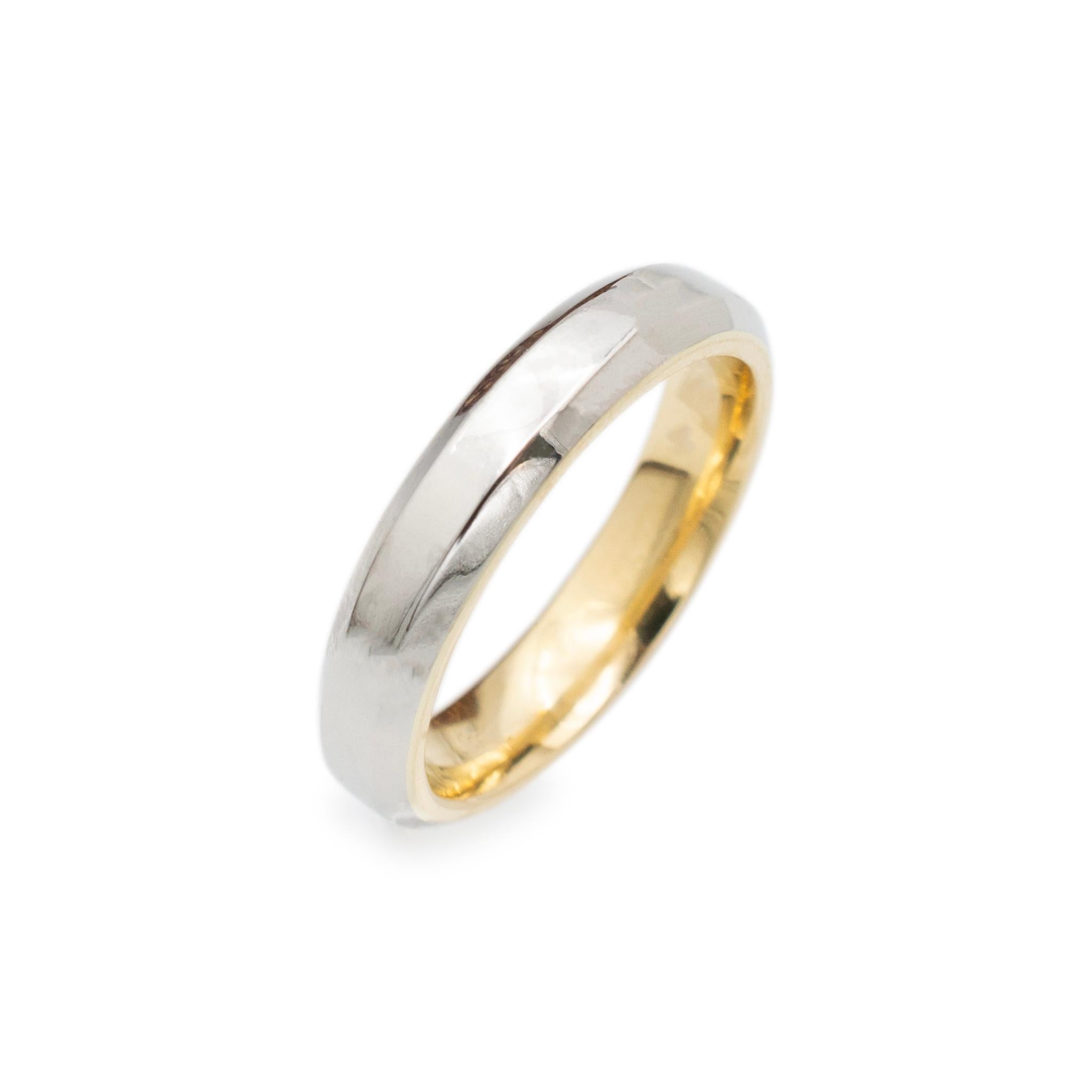 Metal Type: 18K Yellow Gold and 900 Platinum

Gender: Unisex

Size: 8

Width: 4.45 mm

Weight: 9.74 grams

18K yellow gold and 900 platinum, wedding band with a tapered, comfort-fit shank. Engraved with 