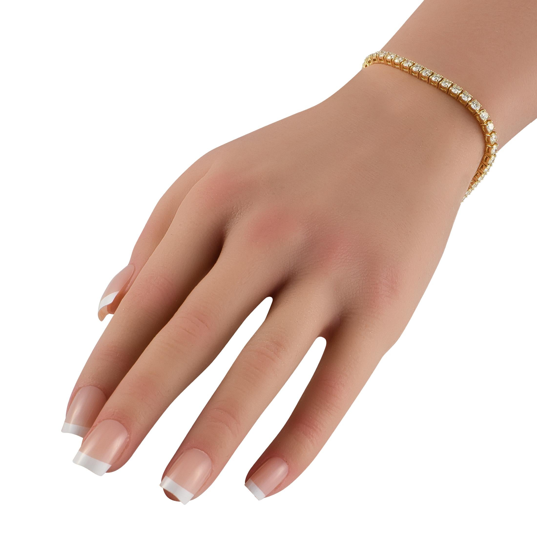 This tennis bracelet is a timeless piece that will never go out of style. On this piece, a series of sparkling round-cut Diamonds totaling 9.76 carats make a statement from their place within the sleek 18K Yellow Gold setting. Chic and incredibly