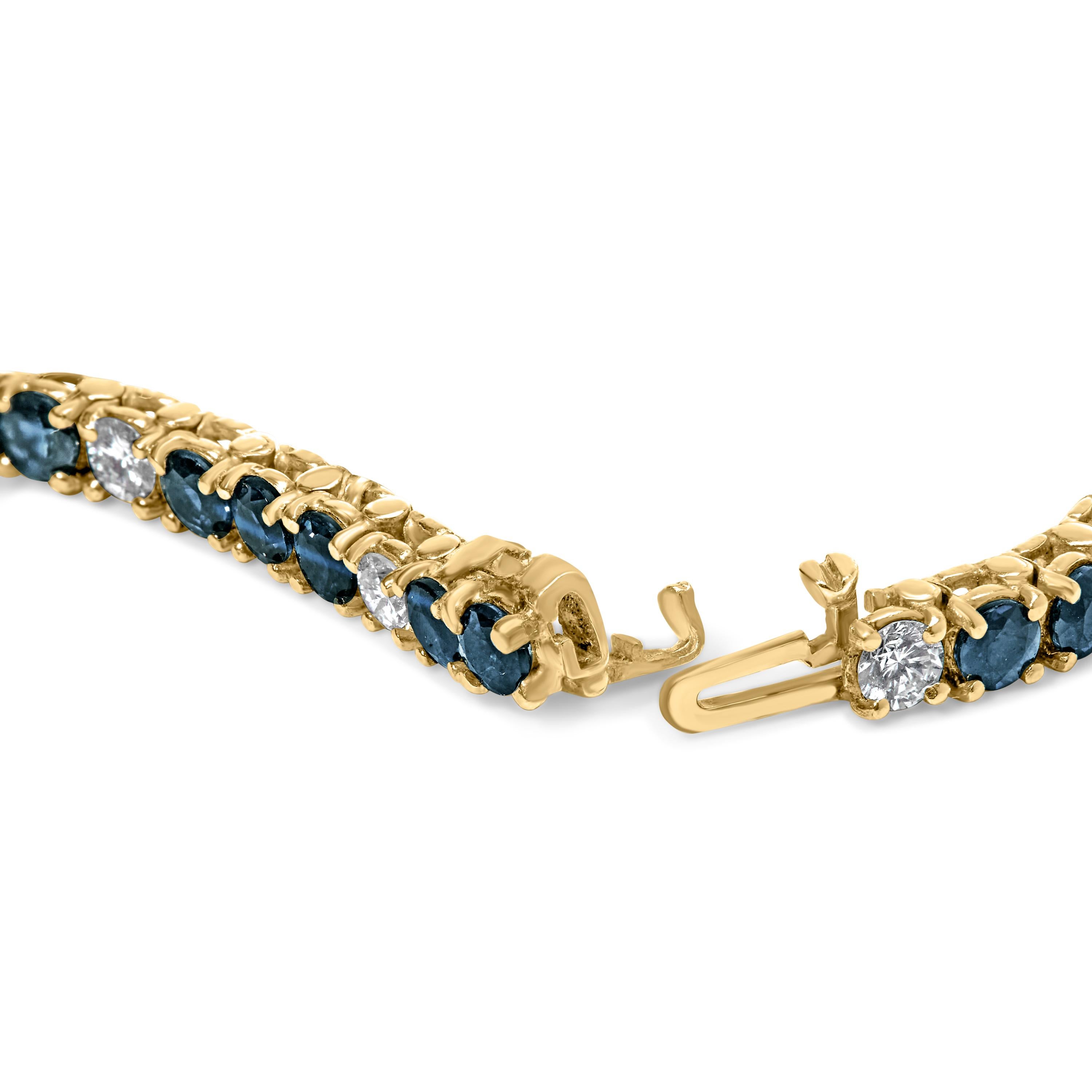 Indulge in sublime elegance with this breathtaking 18K yellow gold bracelet, a harmonious dance of lustrous blue sapphires and dazzling diamonds, designed to enchant and captivate. Every tender inch embraces raw natural beauty, featuring alternating